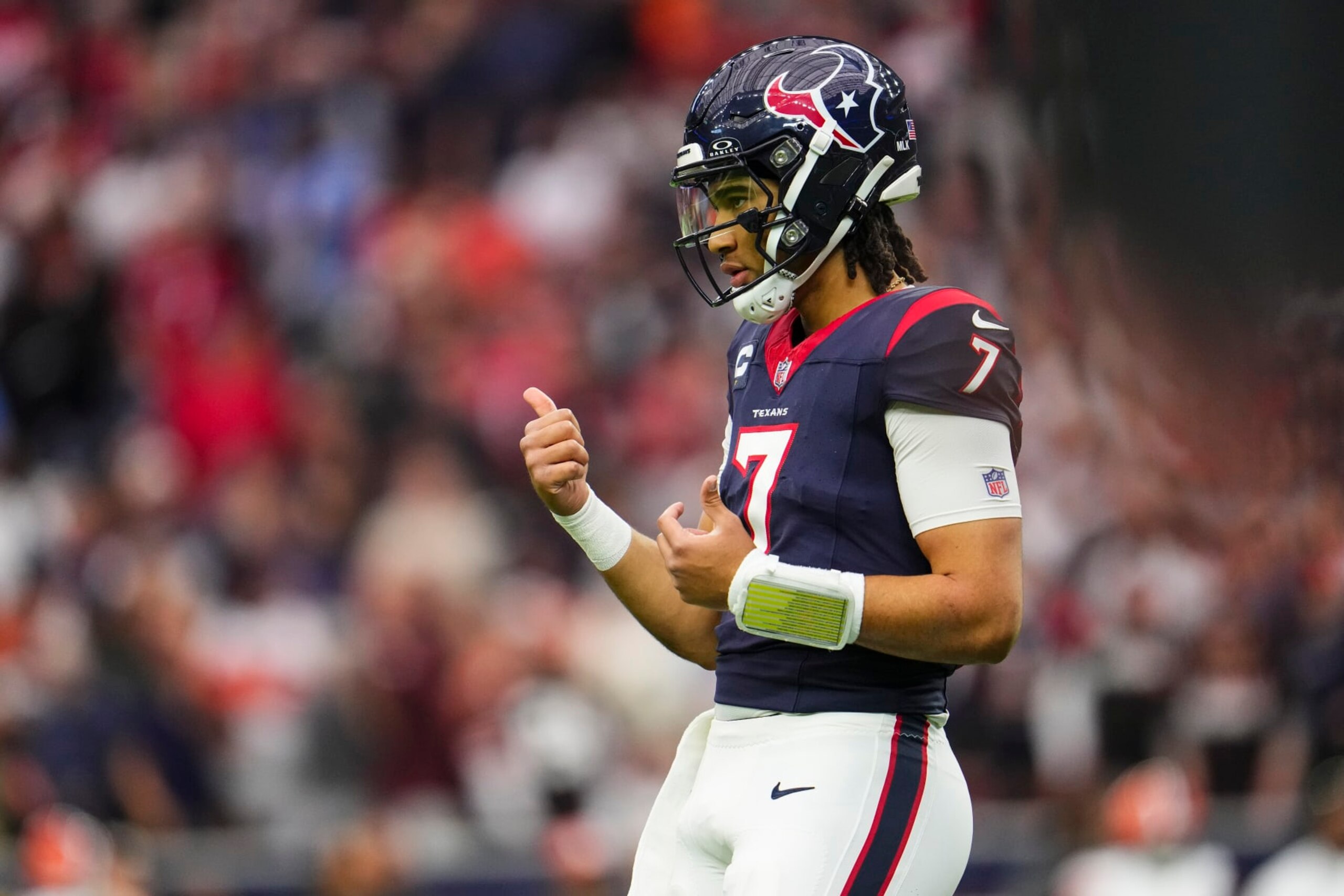 HOUSTON, TX - JANUARY 13: C.J. Stroud #7 of the Houston Texans looks on from the field during an NFL wild-card playoff football game against the Cleveland Browns at NRG Stadium on January 13, 2024 in Houston, Texas. (Photo by Cooper Neill/Getty Images)