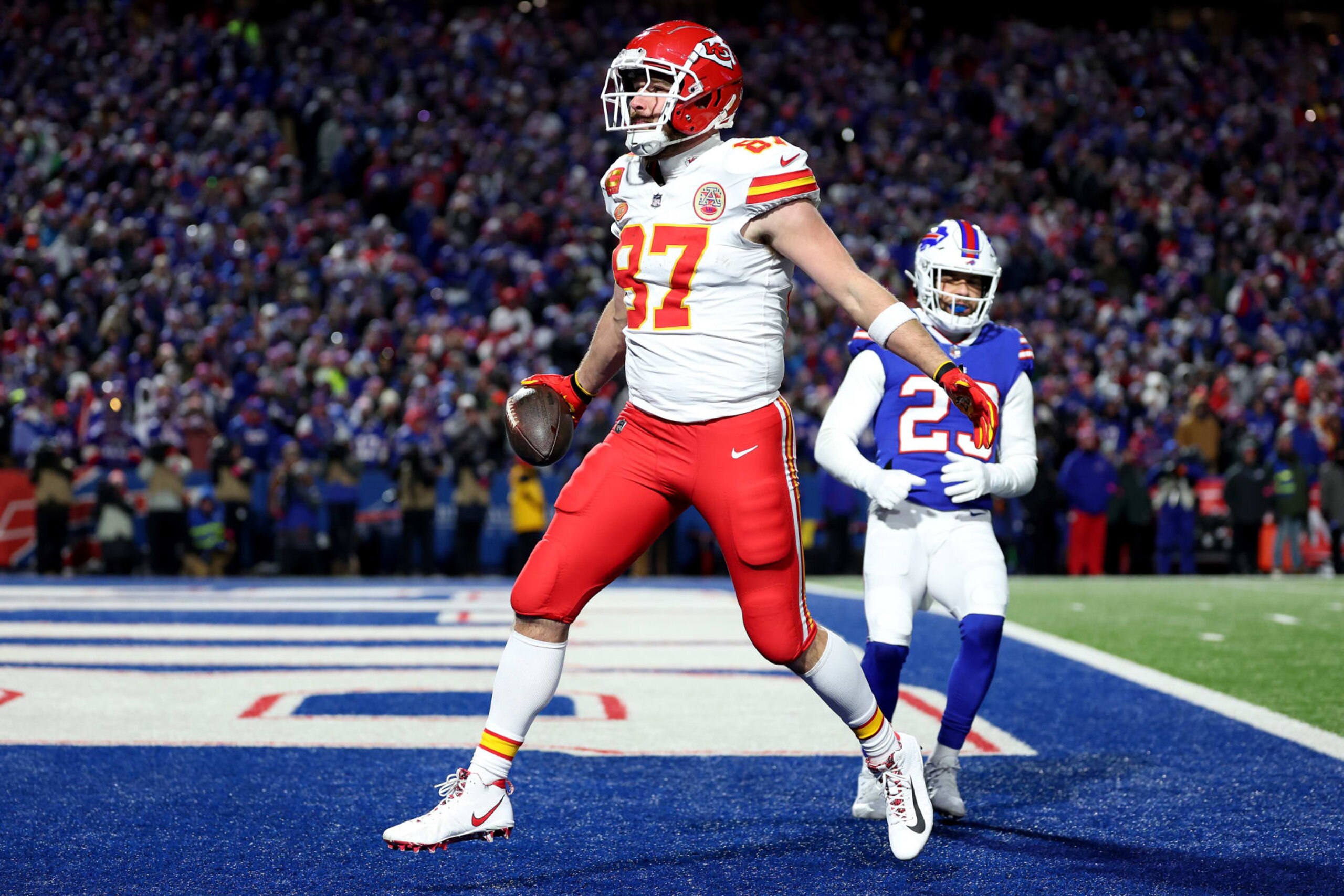 ORCHARD PARK, NEW YORK - JANUARY 21: Travis Kelce #87 of the Kansas City Chiefs celebrates after scoring a 22 yard touchdown against the Buffalo Bills during the second quarter in the AFC Divisional Playoff game at Highmark Stadium on January 21, 2024 in Orchard Park, New York. (Photo by Al Bello/Getty Images)