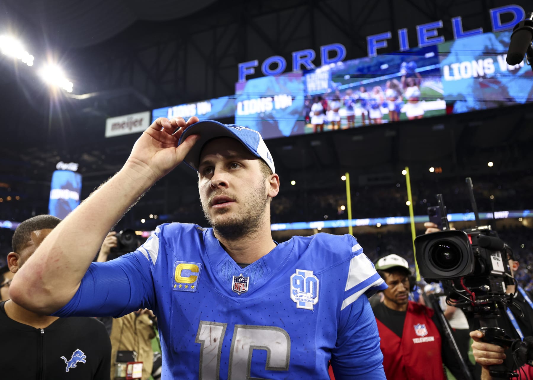 DETROIT, MI - JANUARY 21: Jared Goff #16 of the Detroit Lions walks to midfield after an NFL divisional round playoff football game against the Tampa Bay Buccaneers at Ford Field on January 21, 2024 in Detroit, Michigan. (Photo by Kevin Sabitus/Getty Images)