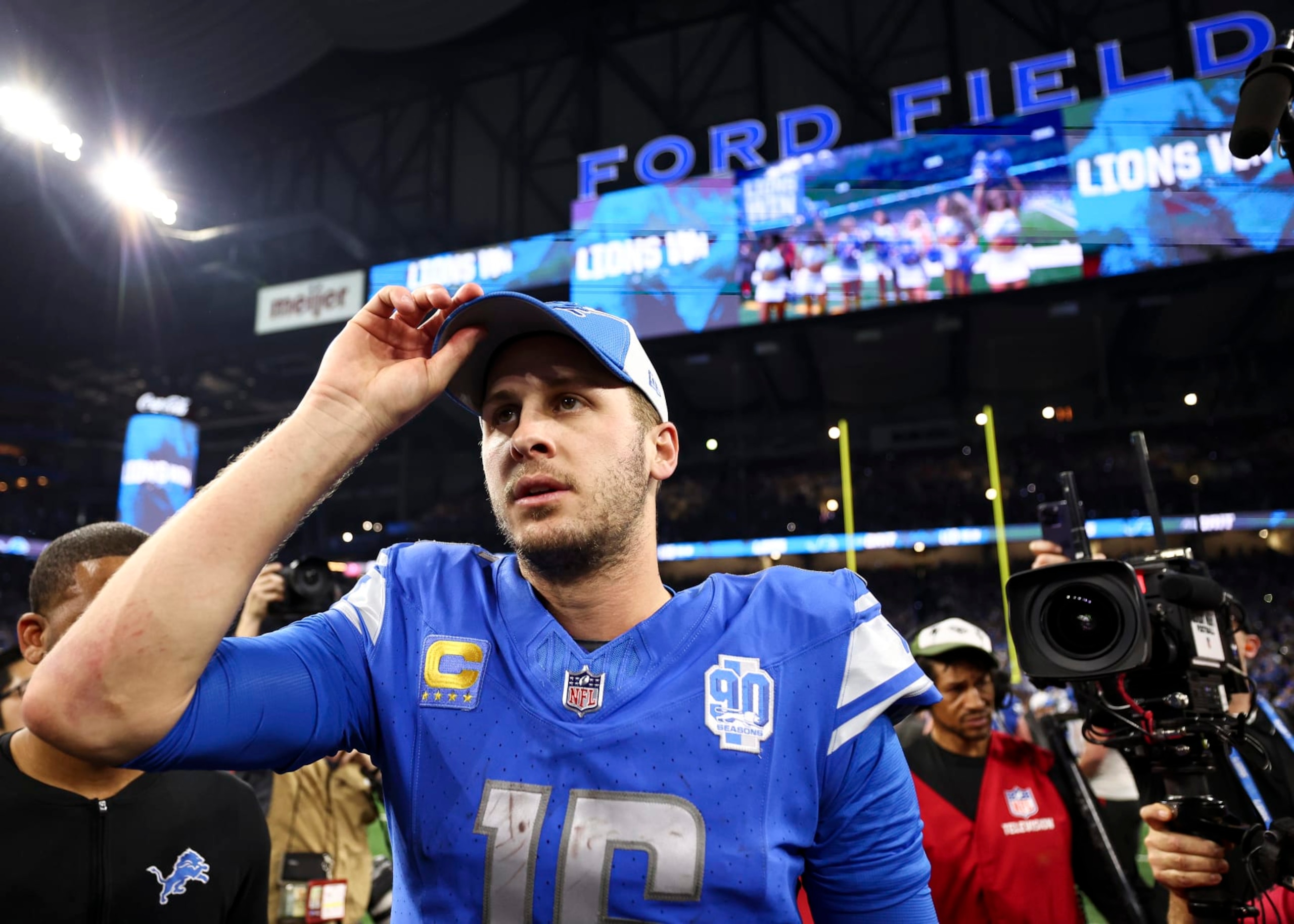 DETROIT, MI - JANUARY 21: Jared Goff #16 of the Detroit Lions walks to midfield after an NFL divisional round playoff football game against the Tampa Bay Buccaneers at Ford Field on January 21, 2024 in Detroit, Michigan. (Photo by Kevin Sabitus/Getty Images)