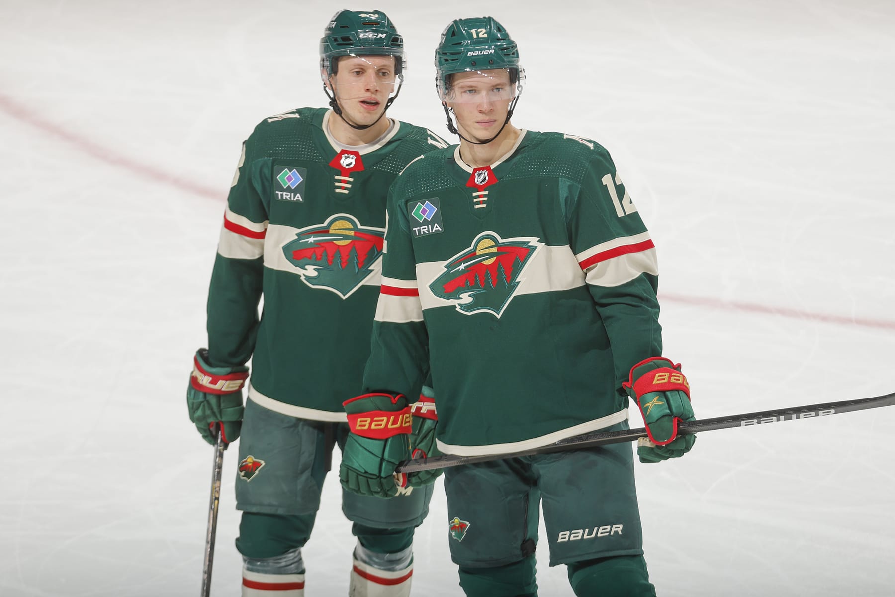 SAINT PAUL, MN - JANUARY 12: Matt Boldy #12 of the Minnesota Wild and Marco Rossi #23 of the Minnesota Wild talk during a break in the game against the Philadelphia Flyers at the Xcel Energy Center on January 12, 2024 in Saint Paul, Minnesota. (Photo by Bruce Kluckhohn/NHLI via Getty Images)