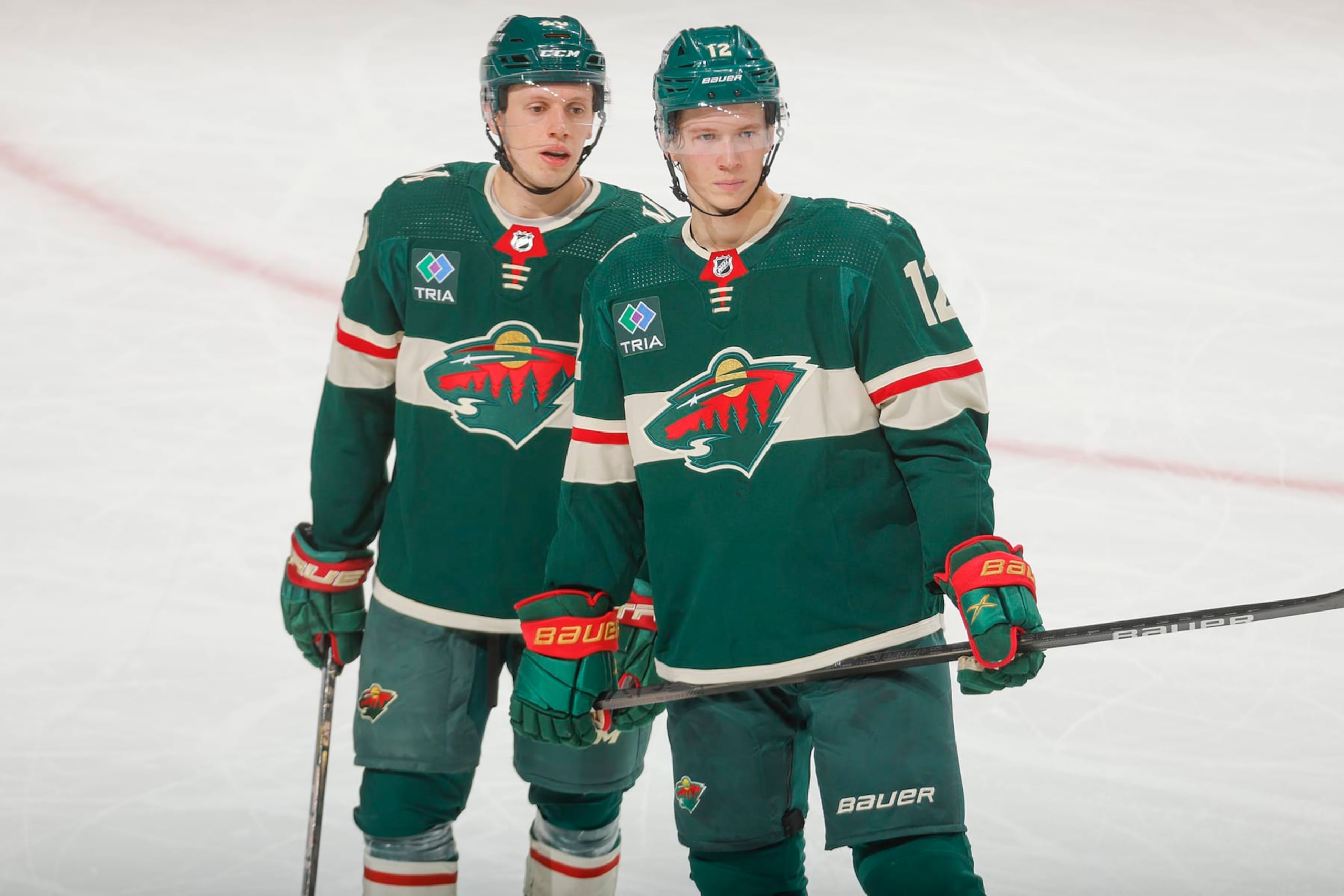 SAINT PAUL, MN - JANUARY 12: Matt Boldy #12 of the Minnesota Wild and Marco Rossi #23 of the Minnesota Wild talk during a break in the game against the Philadelphia Flyers at the Xcel Energy Center on January 12, 2024 in Saint Paul, Minnesota. (Photo by Bruce Kluckhohn/NHLI via Getty Images) SAINT PAUL, MN - JANUARY 12: Matt Boldy #12 of the Minnesota Wild and Marco Rossi #23 of the Minnesota Wild talk during a break in the game against the Philadelphia Flyers at the Xcel Energy Center on January 12, 2024 in Saint Paul, Minnesota. (Photo by Bruce Kluckhohn/NHLI via Getty Images)