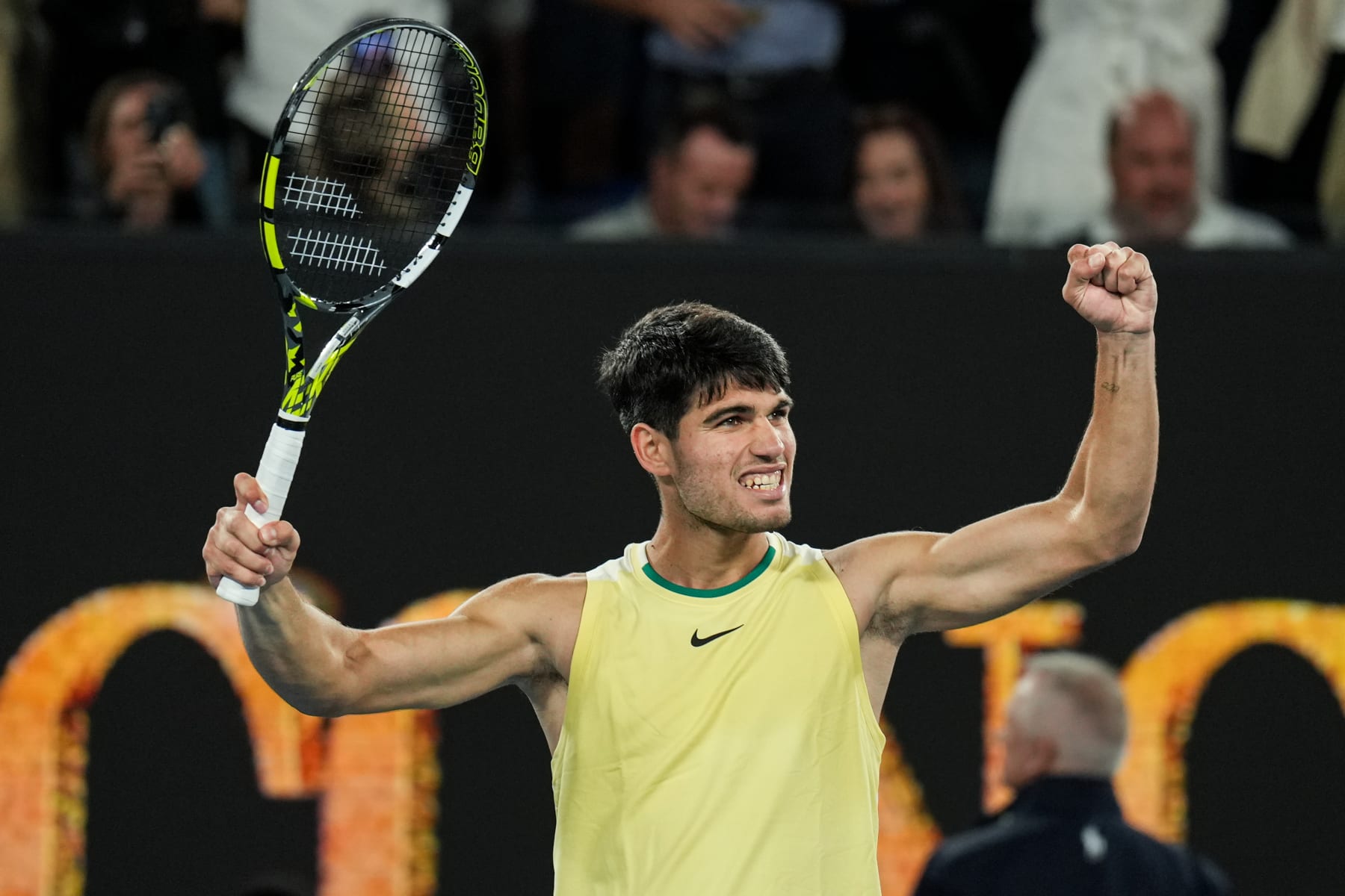 MELBOURNE, AUSTRALIA - JANUARY 22: Carlos Alcaraz of Spain celebrates the victory in the Men's Singles Fourth Round match against Miomir Kecmanovic of Serbia during day nine of the 2024 Australian Open at Melbourne Park on January 22, 2024 in Melbourne, Australia. (Photo by Shi Tang/Getty Images)