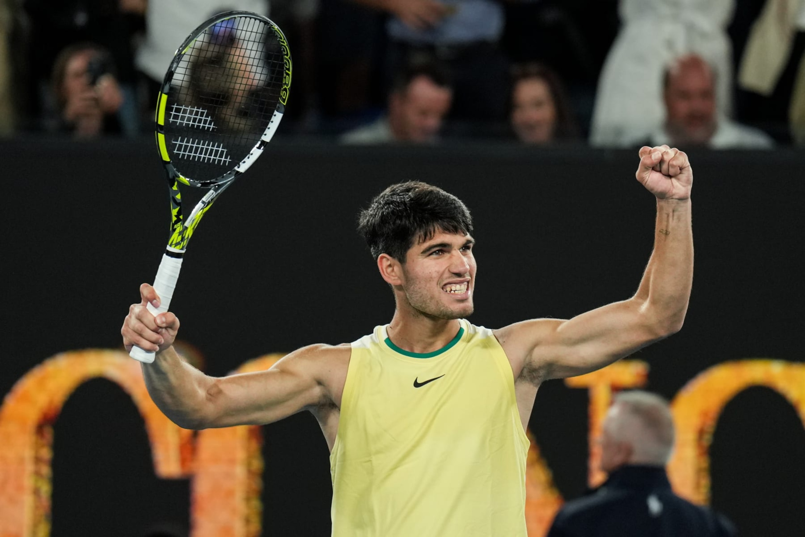 MELBOURNE, AUSTRALIA - JANUARY 22: Carlos Alcaraz of Spain celebrates the victory in the Men's Singles Fourth Round match against Miomir Kecmanovic of Serbia during day nine of the 2024 Australian Open at Melbourne Park on January 22, 2024 in Melbourne, Australia. (Photo by Shi Tang/Getty Images)