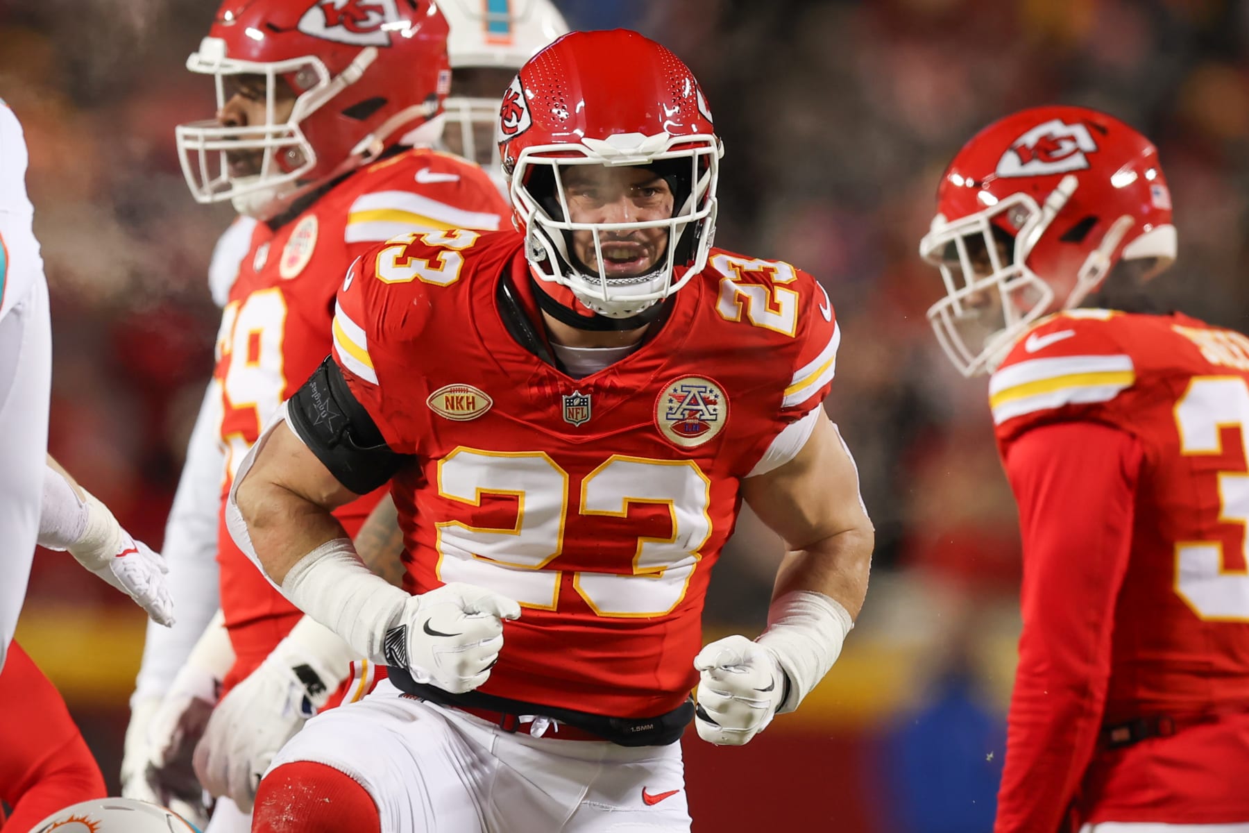 KANSAS CITY, MO - JANUARY 13: Kansas City Chiefs linebacker Drue Tranquill (23) flexes to celebrate a tackle in the first quarter of an AFC Wild Card playoff game between the Miami Dolphins and Kansas City Chiefs on Jan 13, 2024 at GEHA Field at Arrowhead Stadium in Kansas City, MO. (Photo by Scott Winters/Icon Sportswire via Getty Images)