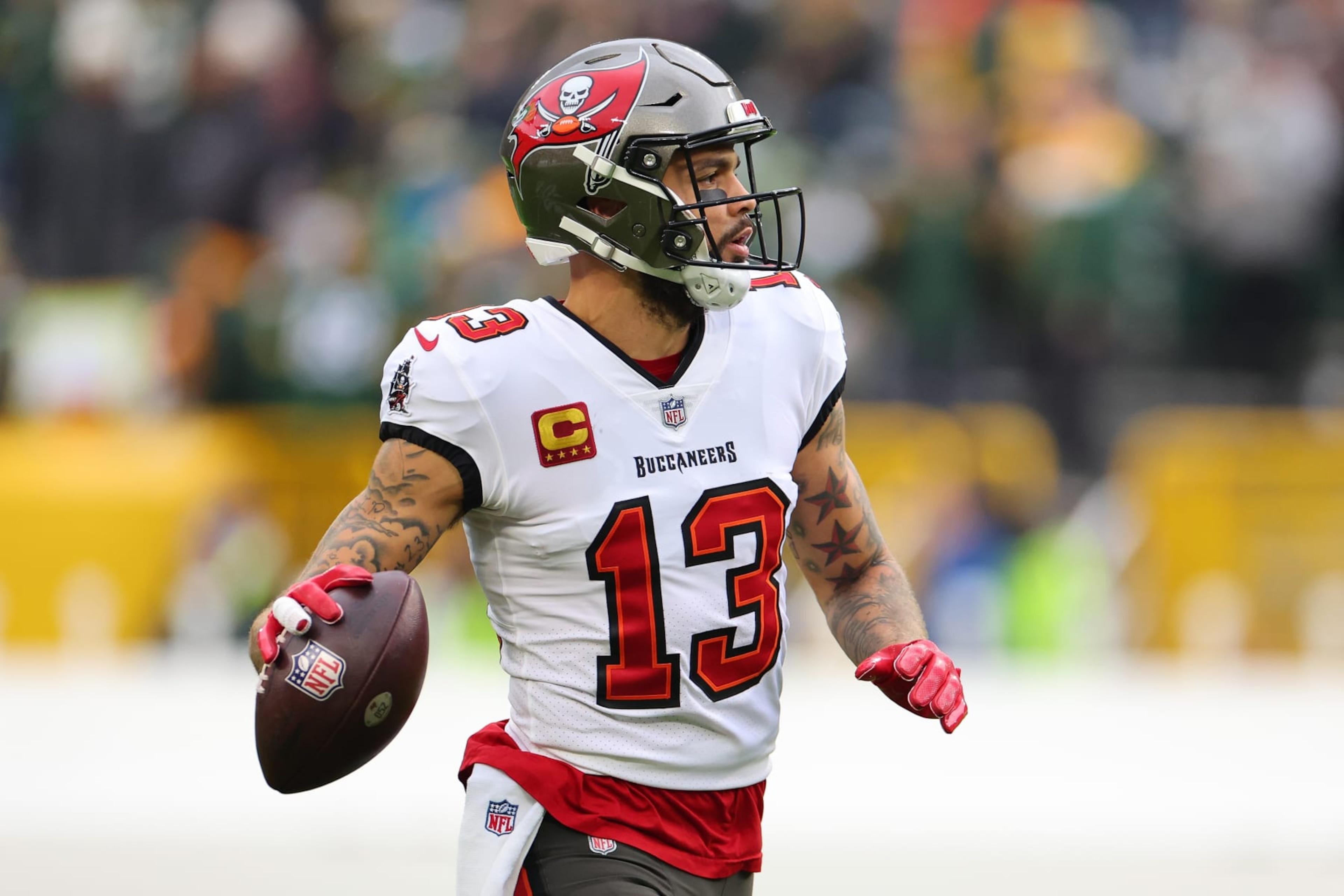 GREEN BAY, WISCONSIN - DECEMBER 17: Mike Evans #13 of the Tampa Bay Buccaneers participates in warmups prior to a game against the Green Bay Packers at Lambeau Field on December 17, 2023 in Green Bay, Wisconsin.  The Buccaneers defeated the Packers 34-20.   (Photo by Stacy Revere/Getty Images)