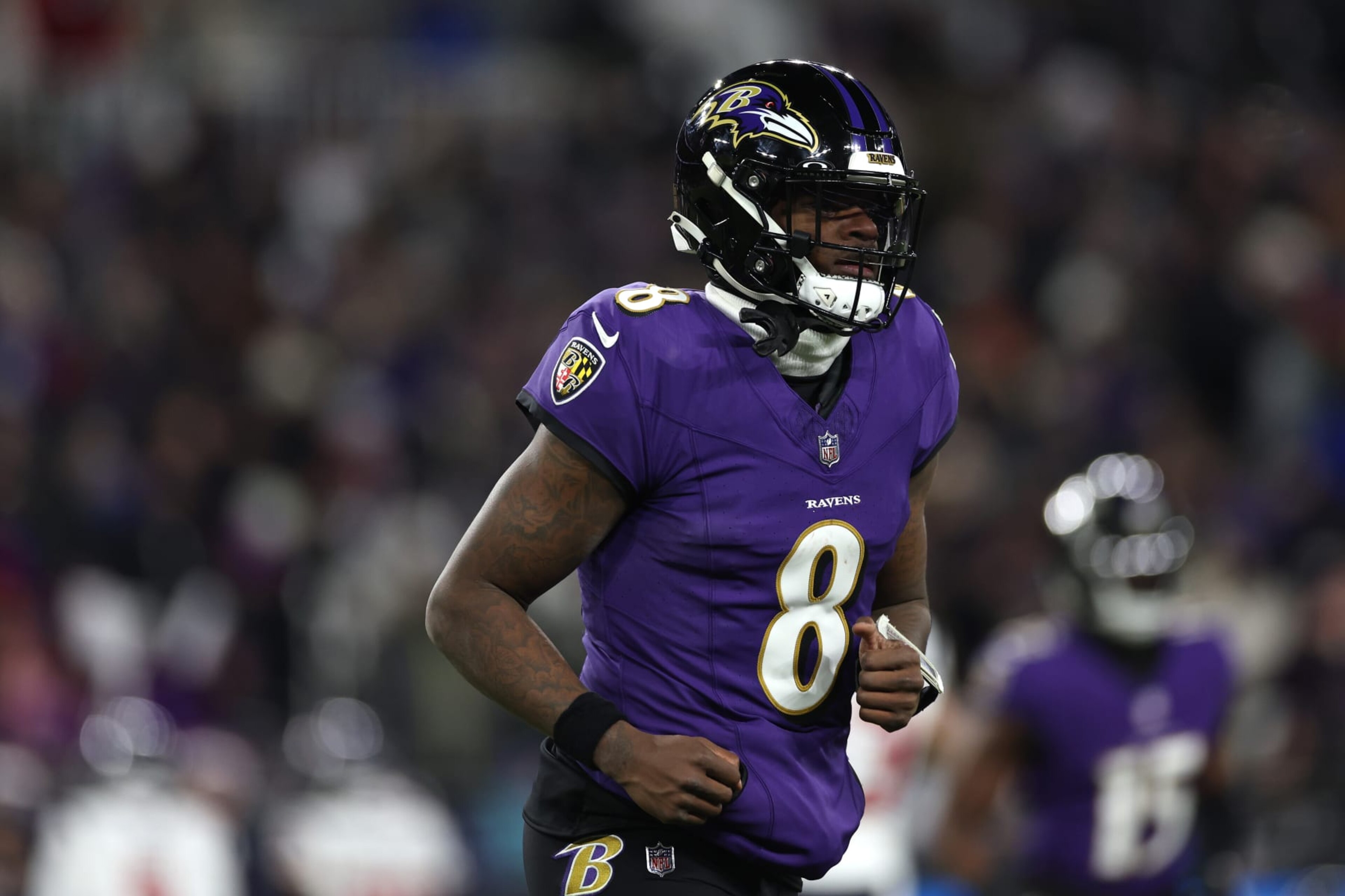 BALTIMORE, MARYLAND - JANUARY 20: Quarterback Lamar Jackson #8 of the Baltimore Ravens reacts against the Houston Texans during the second quarter in the AFC Divisional Playoff game at M&T Bank Stadium on January 20, 2024 in Baltimore, Maryland. (Photo by Patrick Smith/Getty Images)