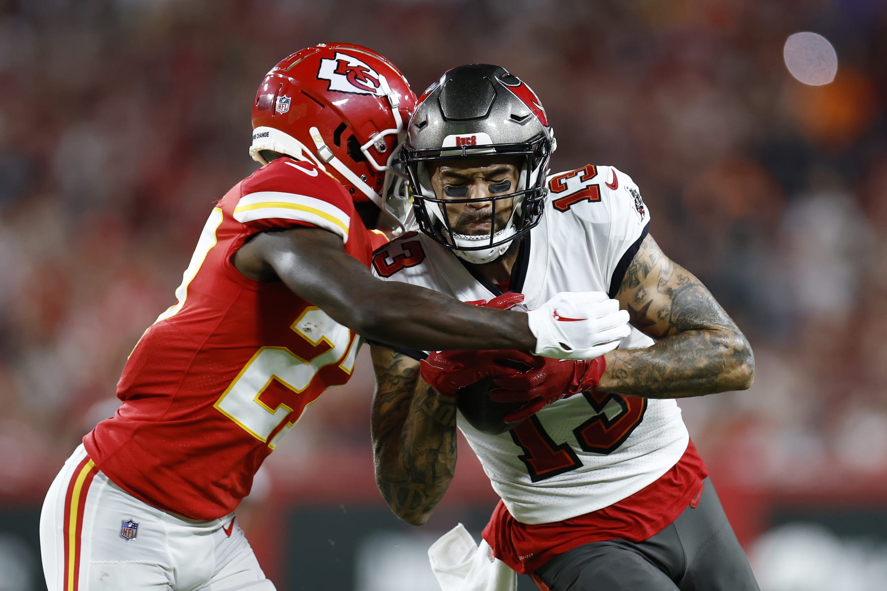 TAMPA, FLORIDA - OCTOBER 02: Mike Evans #13 of the Tampa Bay Buccaneers is tackled by Rashad Fenton #27 of the Kansas City Chiefs during the second quarter at Raymond James Stadium on October 02, 2022 in Tampa, Florida. (Photo by Douglas P. DeFelice/Getty Images)