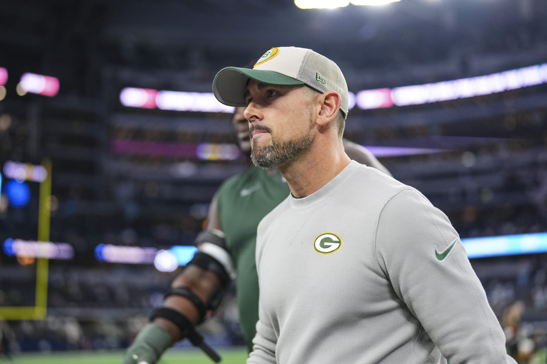 DALLAS, TX - JANUARY 14: Green Bay Packers head coach Matt LaFleur walks off of the field after an NFL wild-card playoff football game against the Dallas Cowboys at AT&T Stadium on January 14, 2024 in Dallas, Texas. (Photo by Cooper Neill/Getty Images)