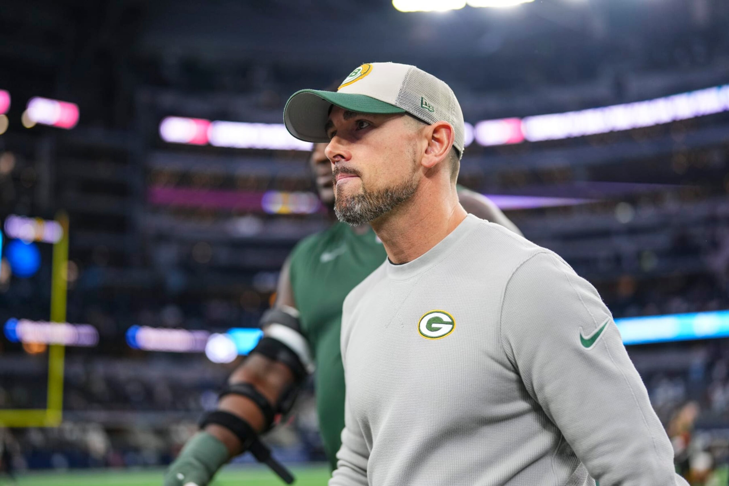 DALLAS, TX - JANUARY 14: Green Bay Packers head coach Matt LaFleur walks off of the field after an NFL wild-card playoff football game against the Dallas Cowboys at AT&T Stadium on January 14, 2024 in Dallas, Texas. (Photo by Cooper Neill/Getty Images)