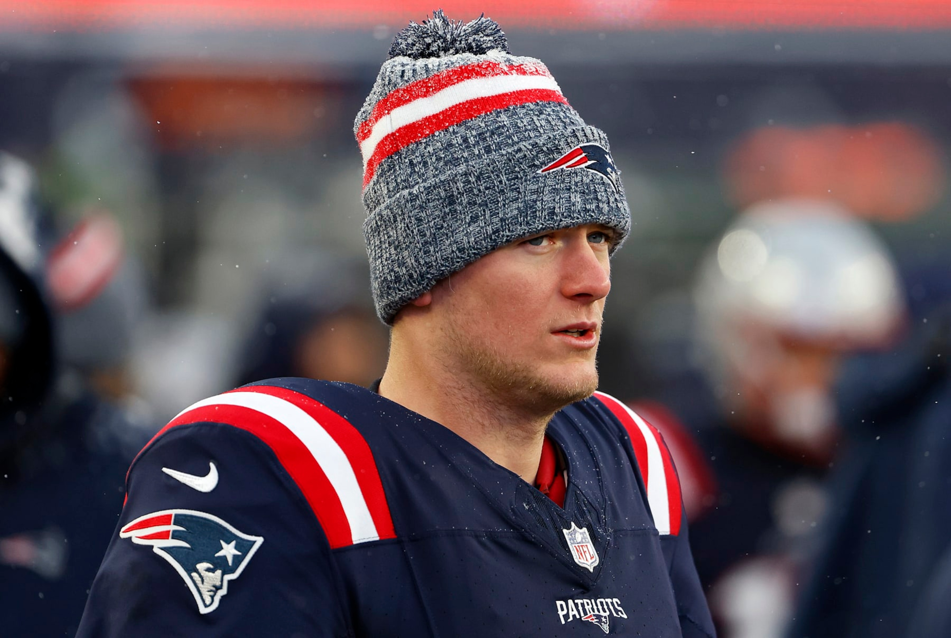 FOXBOROUGH, MASSACHUSETTS - JANUARY 07: Mac Jones #10 of the New England Patriots looks on after a game against the New York Jets at Gillette Stadium on January 07, 2024 in Foxborough, Massachusetts. (Photo by Winslow Townson/Getty Images) FOXBOROUGH, MASSACHUSETTS - JANUARY 07: Mac Jones #10 of the New England Patriots looks on after a game against the New York Jets at Gillette Stadium on January 07, 2024 in Foxborough, Massachusetts. (Photo by Winslow Townson/Getty Images)