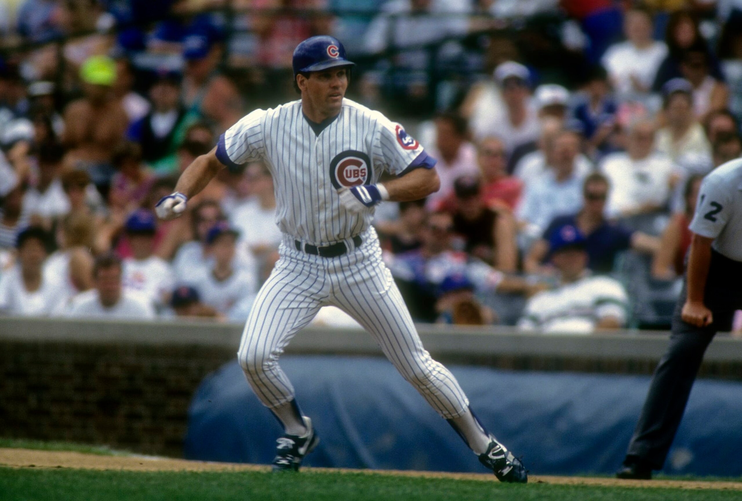 CHICAGO, IL - CIRCA 1992: Ryan Sandberg #23 of the Chicago Cubs leads off from first base during a MLB baseball game circa early 1992 at Wrigley Field in Chicago, Illinois. Sandberg played for the Cubs from 1981-97. (Photo by Focus on Sport/Getty Images) 