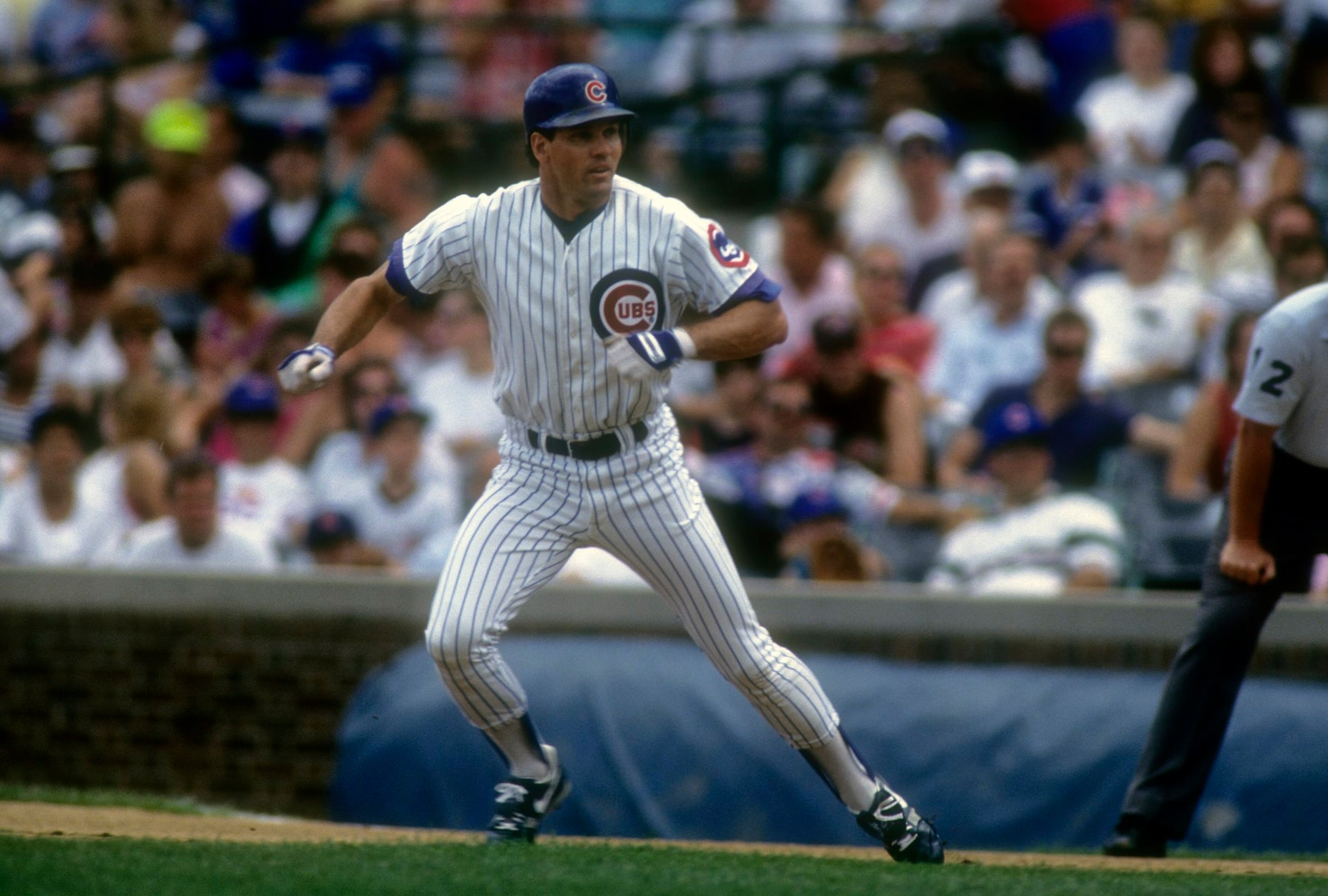 CHICAGO, IL - CIRCA 1992: Ryan Sandberg #23 of the Chicago Cubs leads off from first base during a MLB baseball game circa early 1992 at Wrigley Field in Chicago, Illinois. Sandberg played for the Cubs from 1981-97. (Photo by Focus on Sport/Getty Images) 