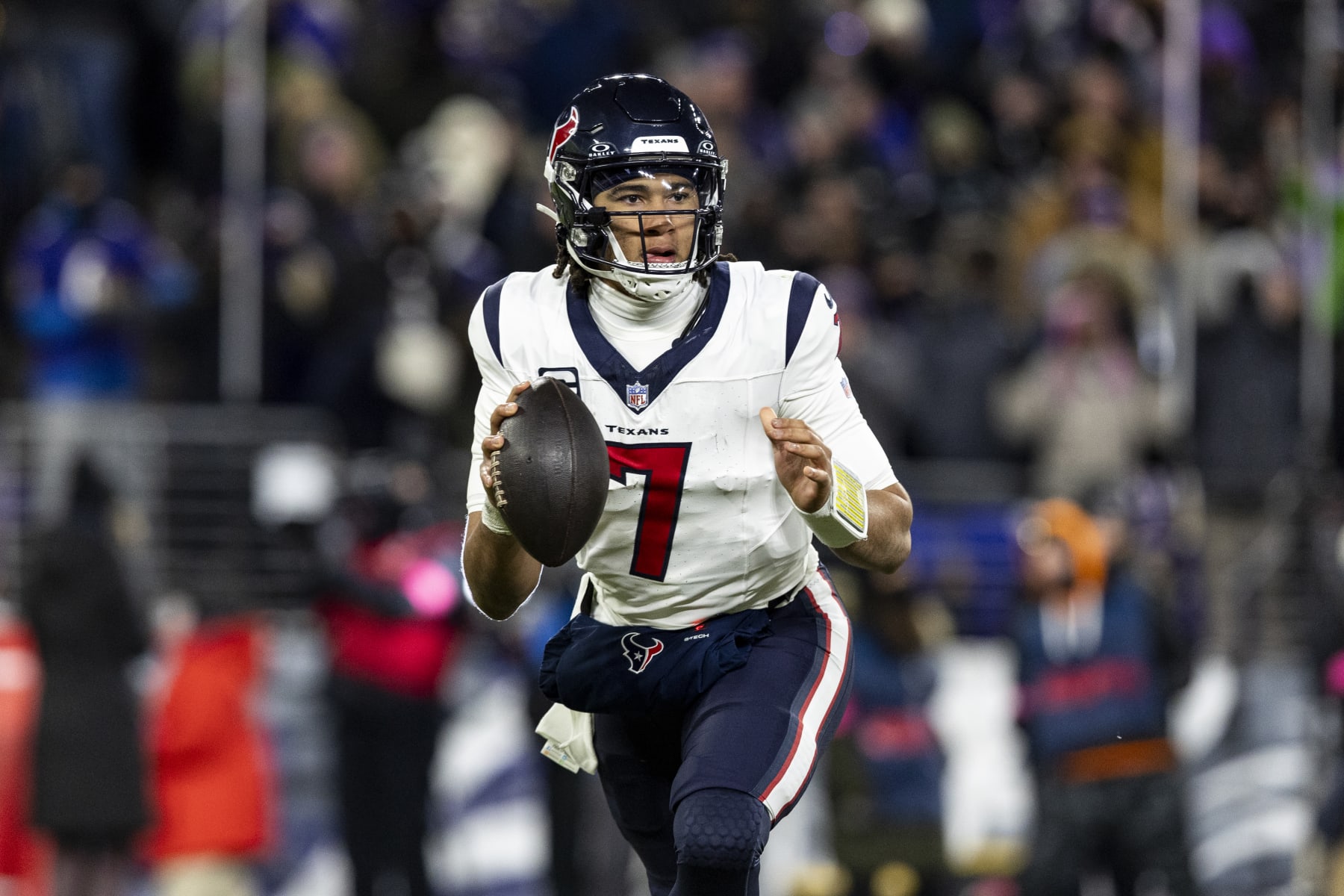 BALTIMORE, MARYLAND - JANUARY 20: C.J. Stroud #7 of the Houston Texans runs the ball during the game against the Baltimore Ravens at M&T Bank Stadium on January 20, 2024 in Baltimore, Maryland. The Ravens beat the Texans 34-10. (Photo by Lauren Leigh Bacho/Getty Images)