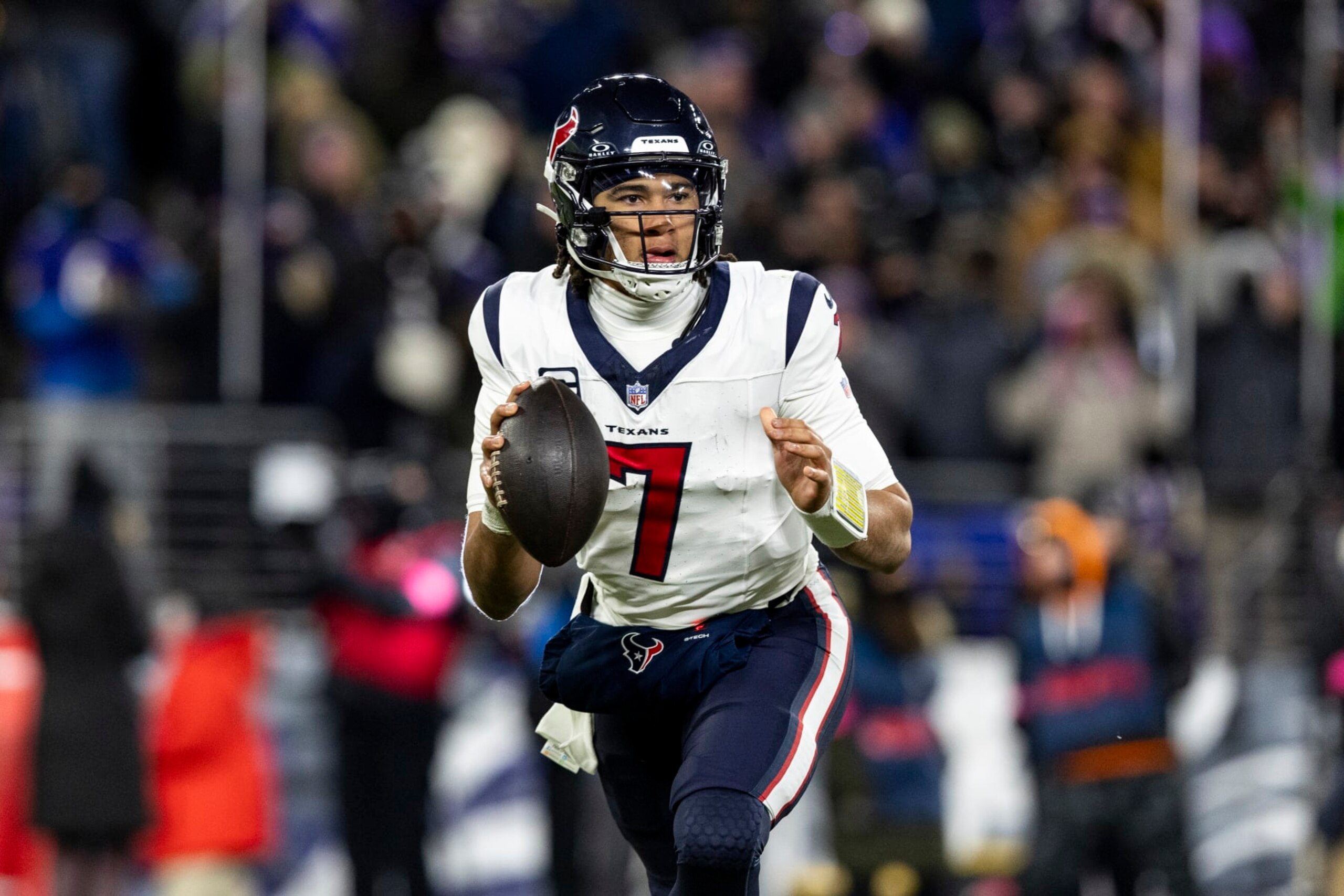 BALTIMORE, MARYLAND - JANUARY 20: C.J. Stroud #7 of the Houston Texans runs the ball during the game against the Baltimore Ravens at M&T Bank Stadium on January 20, 2024 in Baltimore, Maryland. The Ravens beat the Texans 34-10. (Photo by Lauren Leigh Bacho/Getty Images)