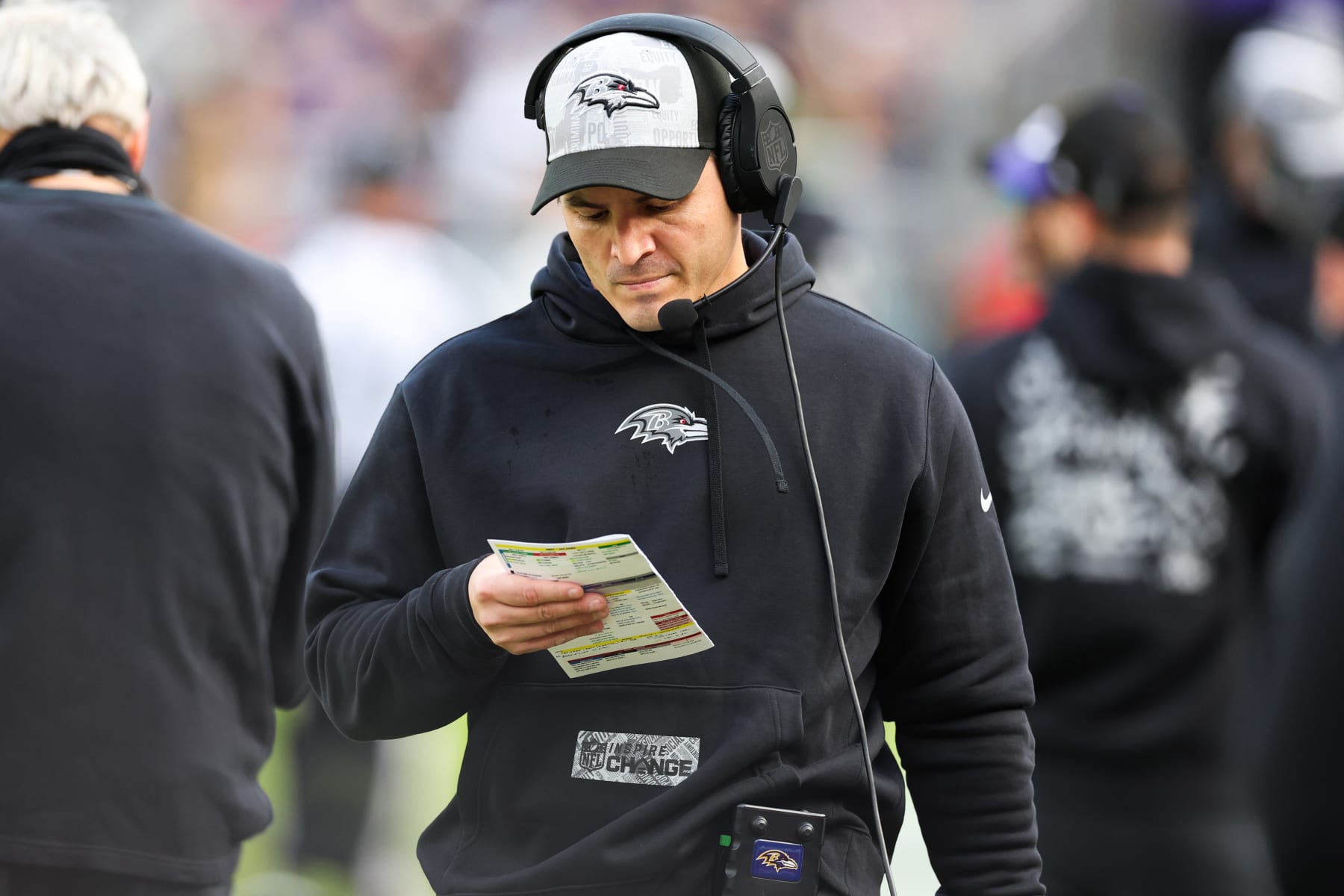 BALTIMORE, MARYLAND - DECEMBER 31: Defensive coordinator Mike Macdonald of the Baltimore Ravens looks on during the first half of the game against the Miami Dolphins at M&T Bank Stadium on December 31, 2023 in Baltimore, Maryland. (Photo by Todd Olszewski/Getty Images)