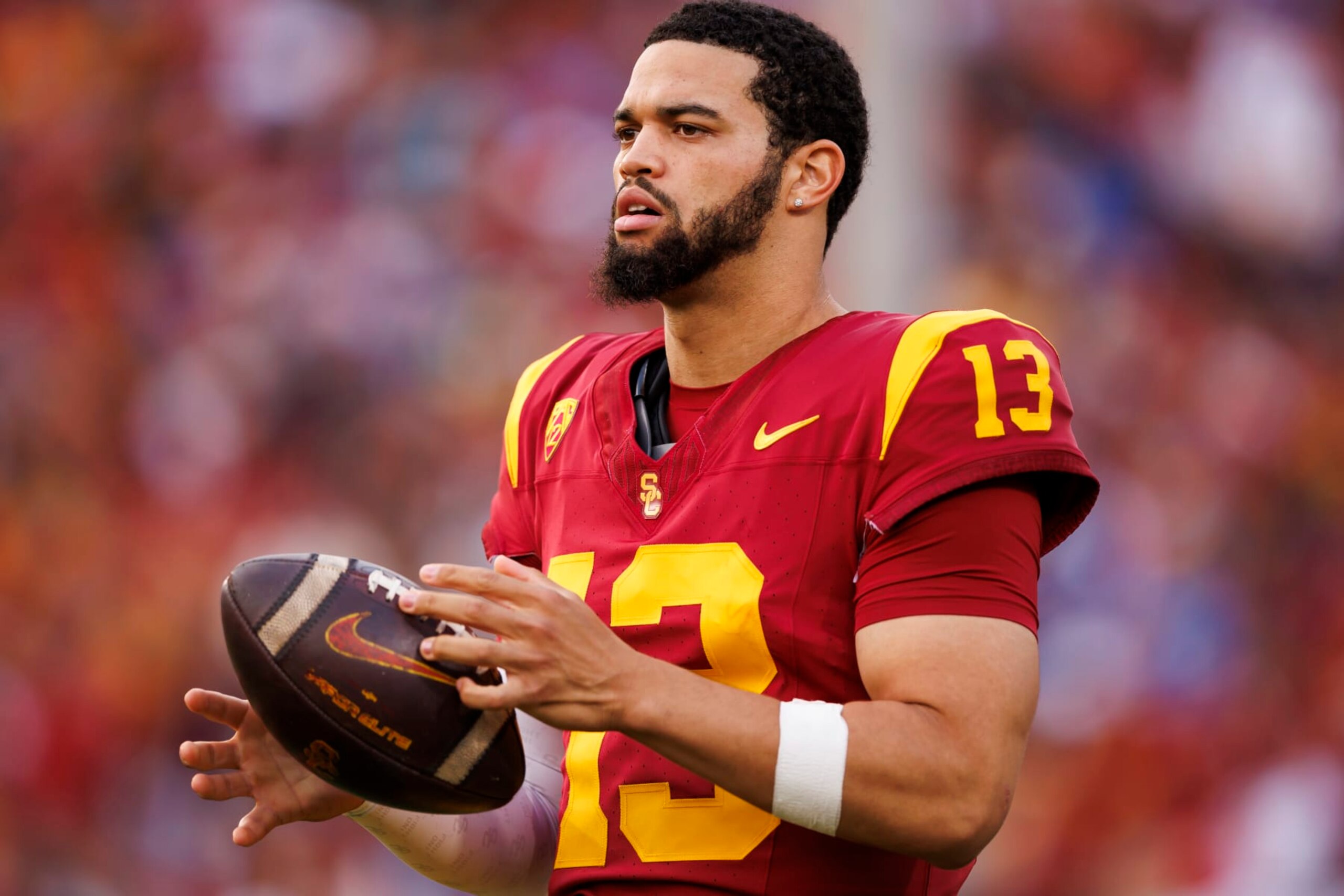 LOS ANGELES, CALIFORNIA - NOVEMBER 18: Caleb Williams #13 of the USC Trojans looks to throw a pass on the sideline during the first half of a game against the UCLA Bruins at United Airlines Field at the Los Angeles Memorial Coliseum on November 18, 2023 in Los Angeles, California. (Photo by Ryan Kang/Getty Images)