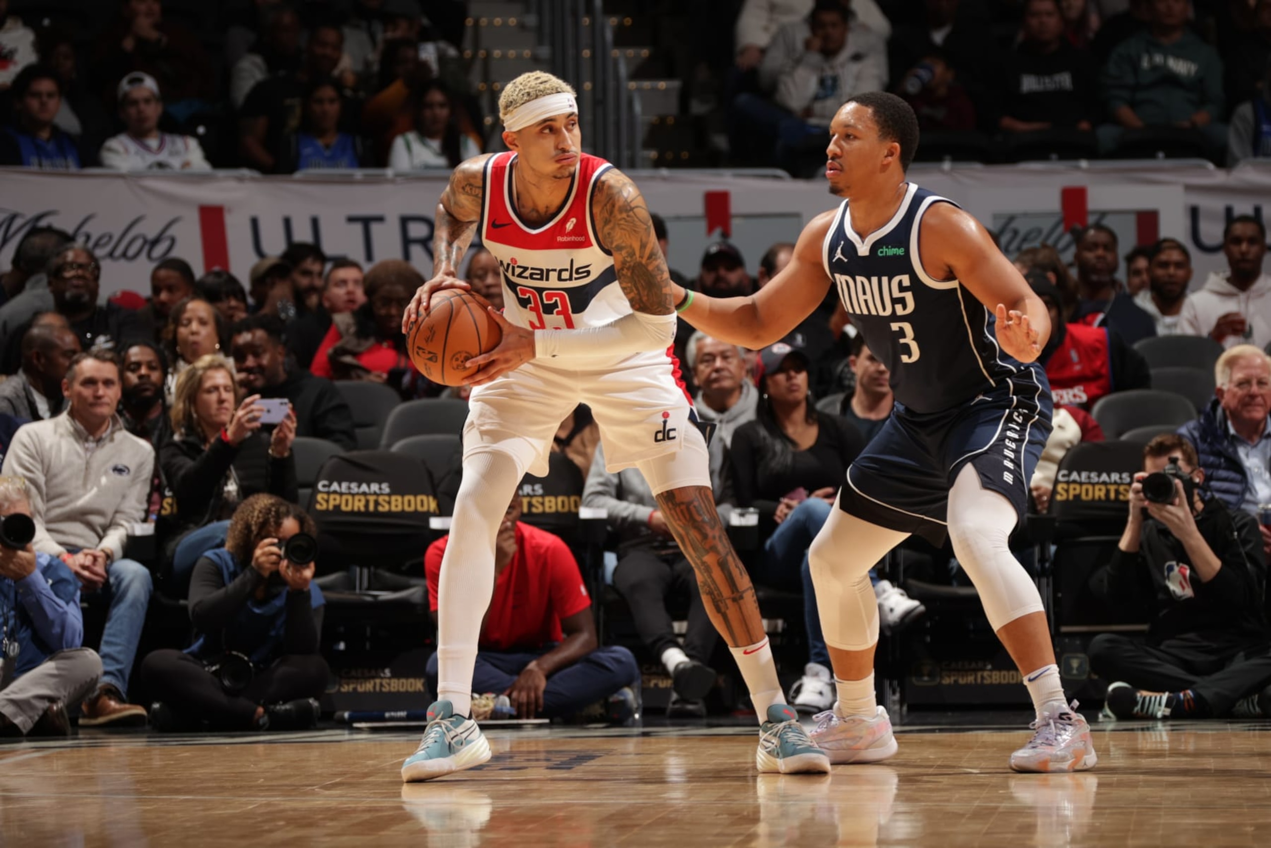 WASHINGTON, DC -  NOVEMBER 15: Kyle Kuzma #33 of the Washington Wizards looks to pass the ball during the game against the Dallas Mavericks on November 15, 2023 at Capital One Arena in Washington, DC. NOTE TO USER: User expressly acknowledges and agrees that, by downloading and or using this Photograph, user is consenting to the terms and conditions of the Getty Images License Agreement. Mandatory Copyright Notice: Copyright 2023 NBAE (Photo by KeShawn Ennis/NBAE via Getty Images)