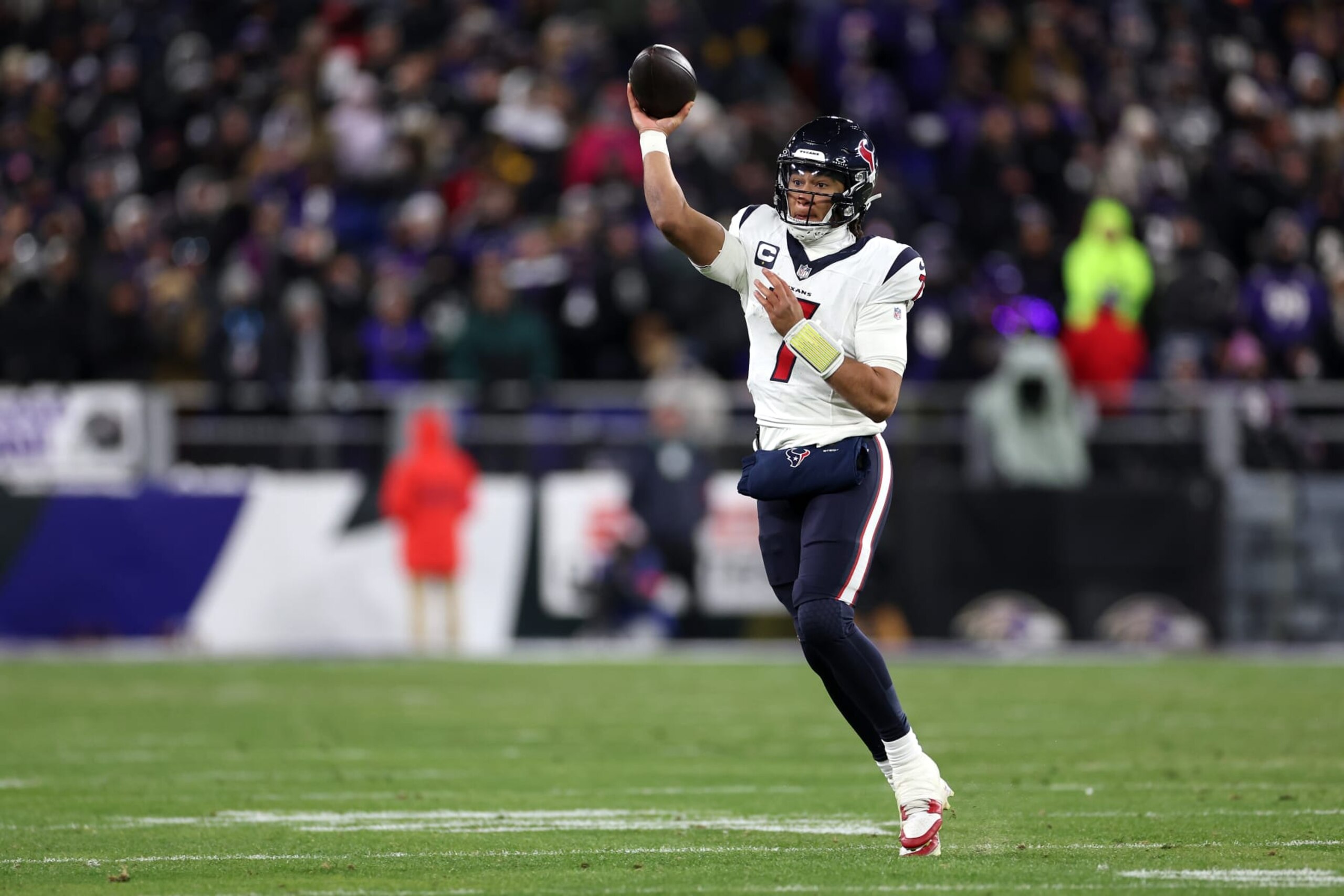 BALTIMORE, MARYLAND - JANUARY 20: Quarterback C.J. Stroud #7 of the Houston Texans looks to pass against the Baltimore Ravens during the AFC Divisional Playoff game at M&T Bank Stadium on January 20, 2024 in Baltimore, Maryland. (Photo by Rob Carr/Getty Images) BALTIMORE, MARYLAND - JANUARY 20: Quarterback C.J. Stroud #7 of the Houston Texans looks to pass against the Baltimore Ravens during the AFC Divisional Playoff game at M&T Bank Stadium on January 20, 2024 in Baltimore, Maryland. (Photo by Rob Carr/Getty Images)