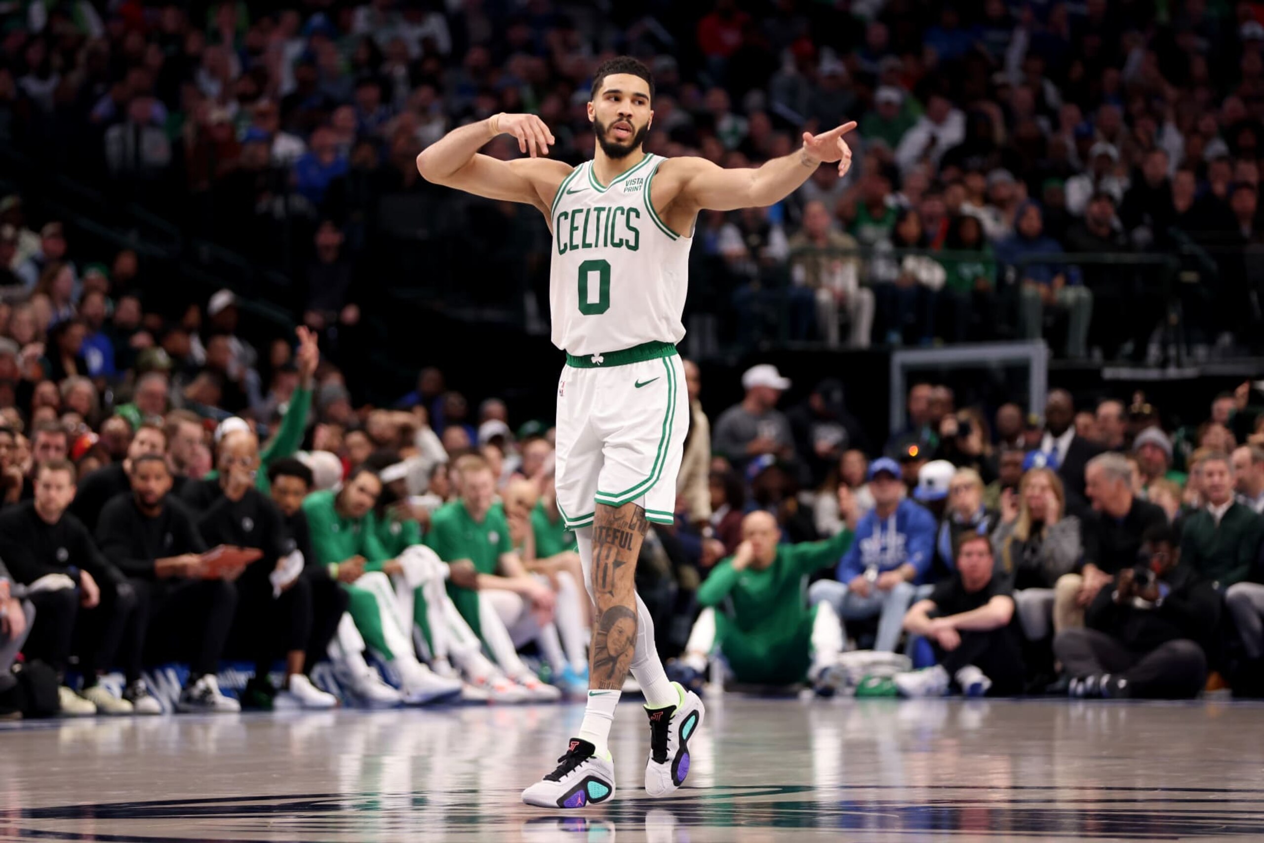 DALLAS, TEXAS - JANUARY 22: Jayson Tatum #0 of the Boston Celtics reacts after making a three-point basket against the Dallas Mavericks in the second half at American Airlines Center on January 22, 2024 in Dallas, Texas. NOTE TO USER: User expressly acknowledges and agrees that, by downloading and or using this photograph, User is consenting to the terms and conditions of the Getty Images License Agreement. (Photo by Tim Heitman/Getty Images)