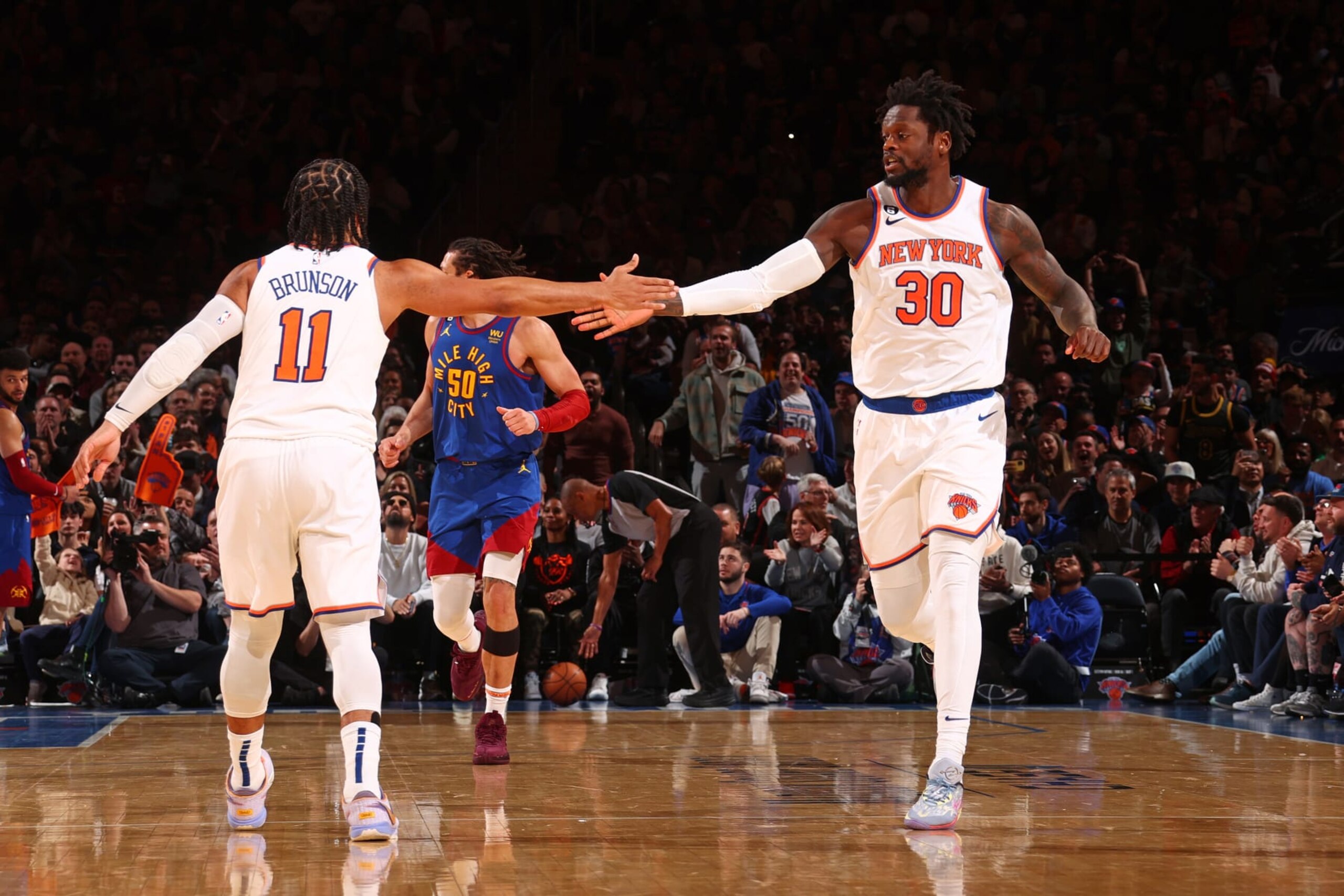 NEW YORK, NY - MARCH 18: Jalen Brunson #11 and Julius Randle #30 of the New York Knicks high fives during the game on March 18, 2023 at Madison Square Garden in New York City, New York.  NOTE TO USER: User expressly acknowledges and agrees that, by downloading and or using this photograph, User is consenting to the terms and conditions of the Getty Images License Agreement. Mandatory Copyright Notice: Copyright 2023 NBAE  (Photo by Nathaniel S. Butler/NBAE via Getty Images)
