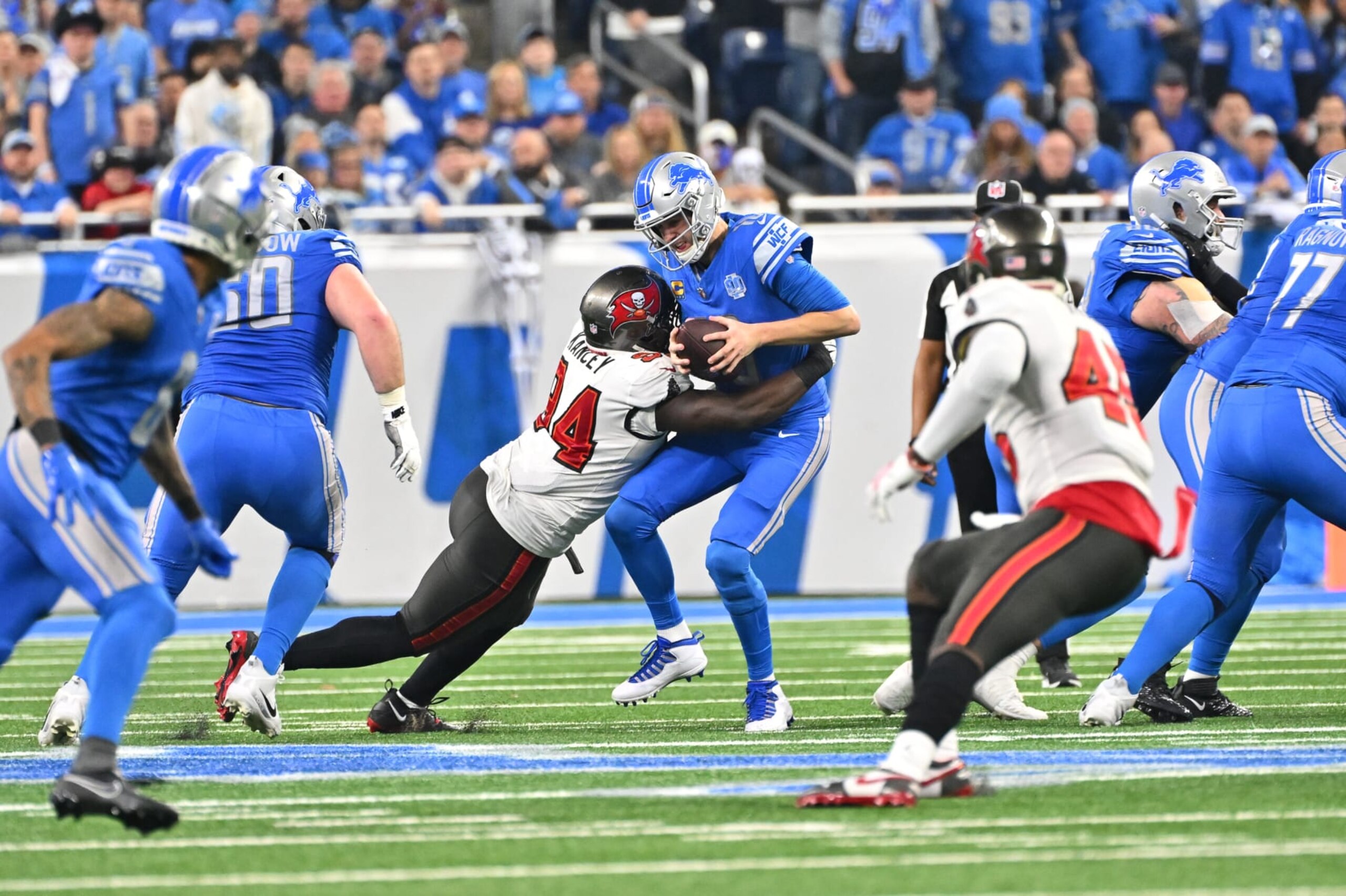 DETROIT, MI - JANUARY 21: Detroit Lions quarterback Jared Goff (16) is sacked by Tampa Bay Buccaneers defensive tackle Calijah Kancey (94) during the NFC Divisional playoff game between the Detroit Lions and the Tampa Bay Buccaneers on Sunday January 21, 2023 at Ford Field in Detroit, MI. (Photo by Steven King/Icon Sportswire via Getty Images) DETROIT, MI - JANUARY 21: Detroit Lions quarterback Jared Goff (16) is sacked by Tampa Bay Buccaneers defensive tackle Calijah Kancey (94) during the NFC Divisional playoff game between the Detroit Lions and the Tampa Bay Buccaneers on Sunday January 21, 2023 at Ford Field in Detroit, MI. (Photo by Steven King/Icon Sportswire via Getty Images)