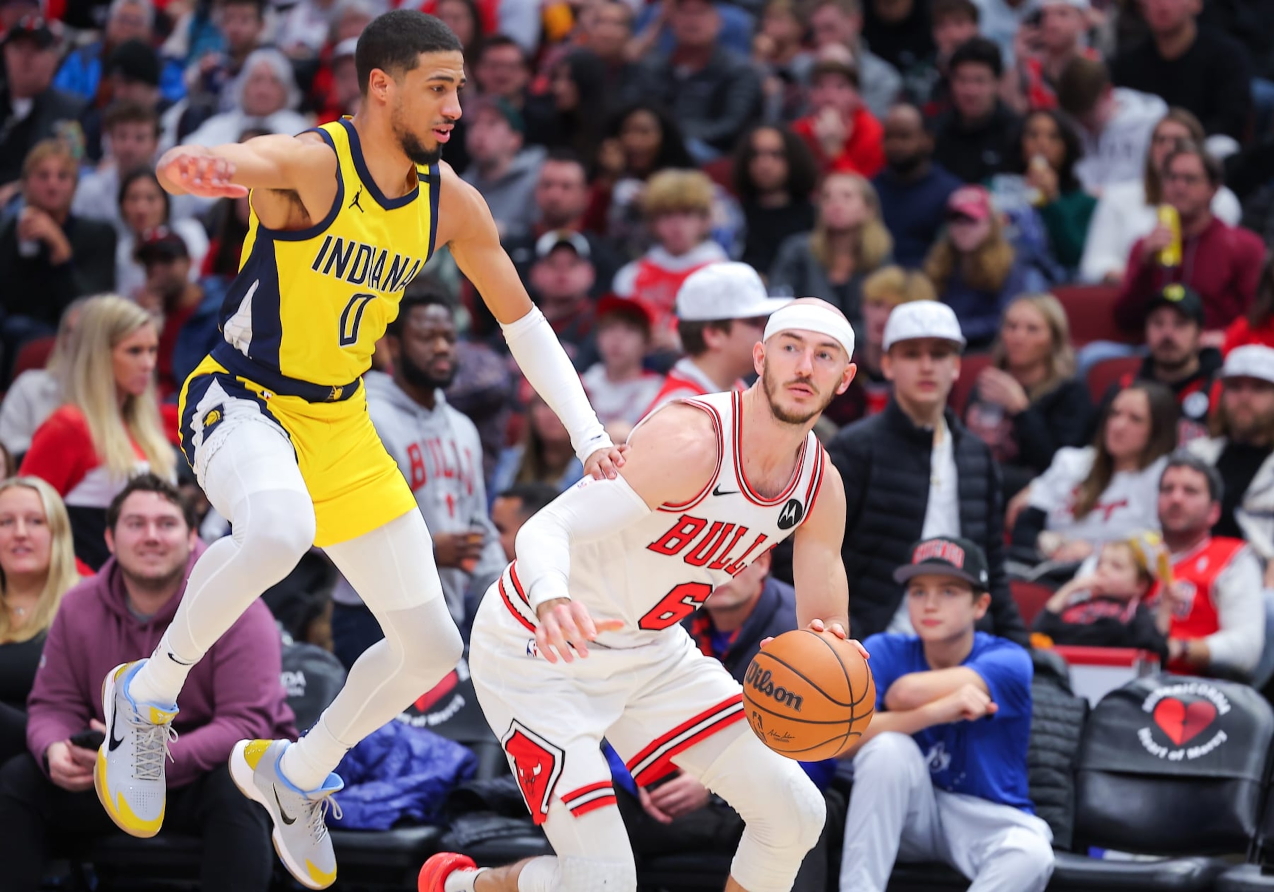 CHICAGO, IL - DECEMBER 28: Tyrese Haliburton #0 of the Indiana Pacers goes past Alex Caruso #6 of the Chicago Bulls during the second half at United Center on December 28, 2023 in Chicago, Illinois. (Photo by Melissa Tamez/Icon Sportswire via Getty Images)