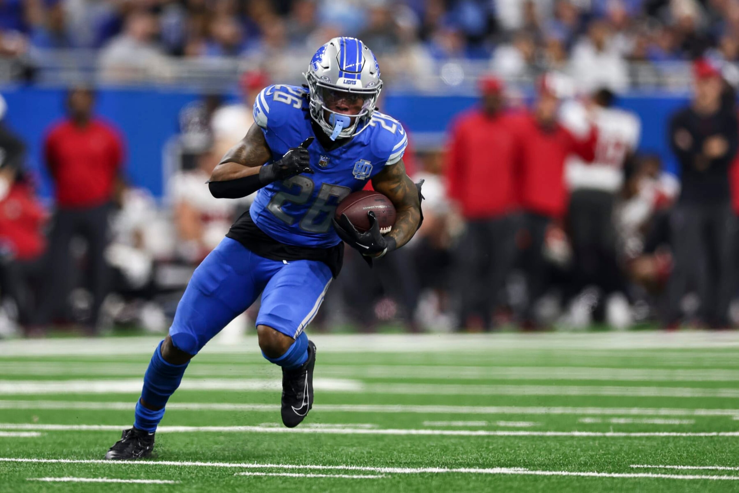 DETROIT, MI - JANUARY 21: Jahmyr Gibbs #26 of the Detroit Lions carries the ball for a touchdown during the fourth quarter of an NFL divisional round playoff football game against the Tampa Bay Buccaneers at Ford Field on January 21, 2024 in Detroit, Michigan. (Photo by Kevin Sabitus/Getty Images) DETROIT, MI - JANUARY 21: Jahmyr Gibbs #26 of the Detroit Lions carries the ball for a touchdown during the fourth quarter of an NFL divisional round playoff football game against the Tampa Bay Buccaneers at Ford Field on January 21, 2024 in Detroit, Michigan. (Photo by Kevin Sabitus/Getty Images)