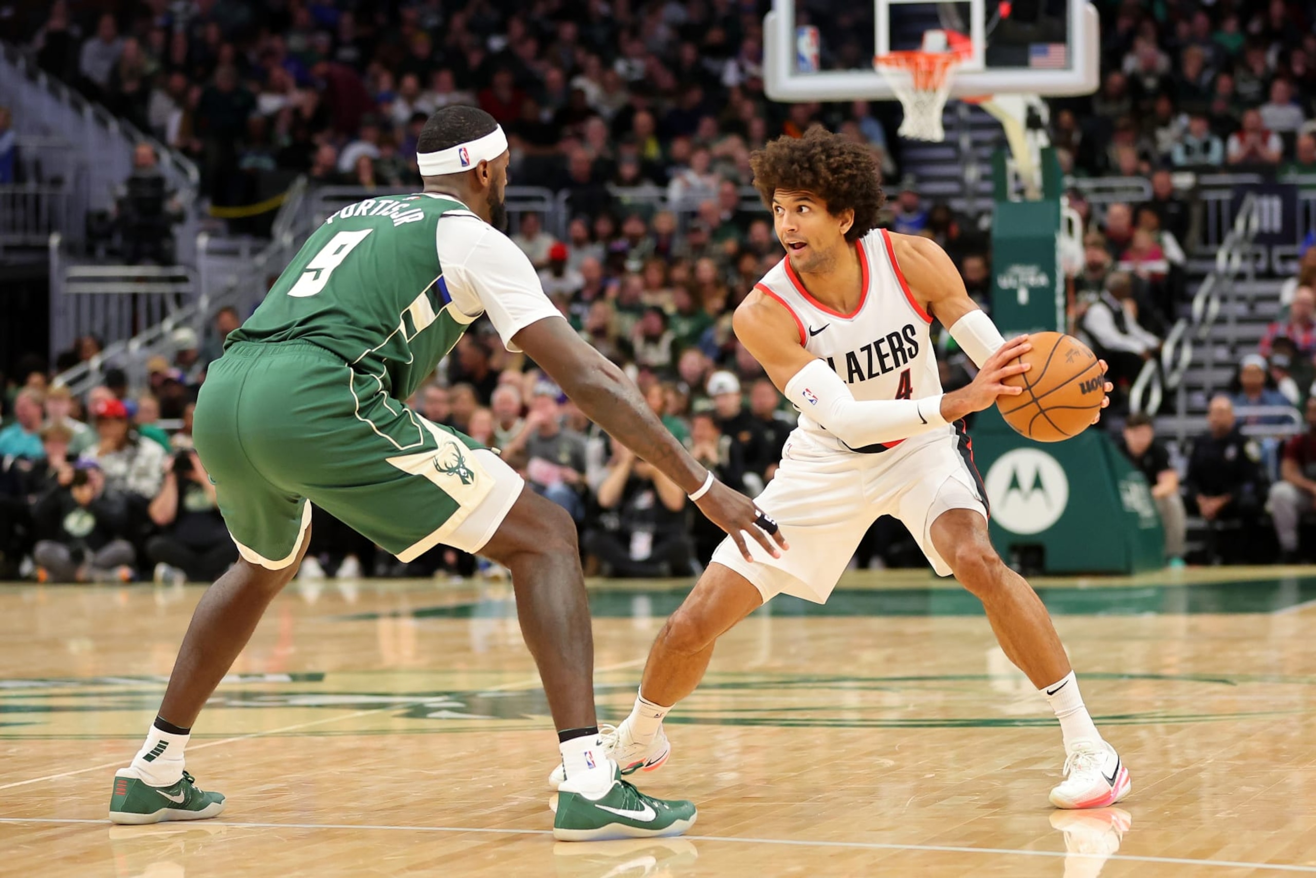 MILWAUKEE, WISCONSIN - NOVEMBER 26: Matisse Thybulle #4 of the Portland Trail Blazers is defended by Bobby Portis #9 of the Milwaukee Bucks during a game at Fiserv Forum on November 26, 2023 in Milwaukee, Wisconsin. NOTE TO USER: User expressly acknowledges and agrees that, by downloading and or using this photograph, User is consenting to the terms and conditions of the Getty Images License Agreement. (Photo by Stacy Revere/Getty Images)
