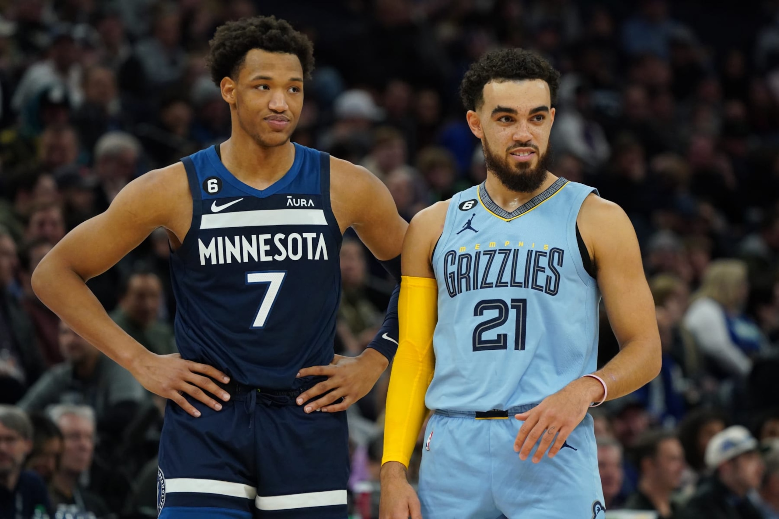 MINNEAPOLIS, MN -  NOVEMBER 30: Wendell Moore Jr. #7 of the Minnesota Timberwolves and Tyus Jones #21 of the Memphis Grizzlies stand on the court on November 30, 2022 at Target Center in Minneapolis, Minnesota. NOTE TO USER: User expressly acknowledges and agrees that, by downloading and or using this Photograph, user is consenting to the terms and conditions of the Getty Images License Agreement. Mandatory Copyright Notice: Copyright 2022 NBAE (Photo by Jordan Johnson/NBAE via Getty Images)