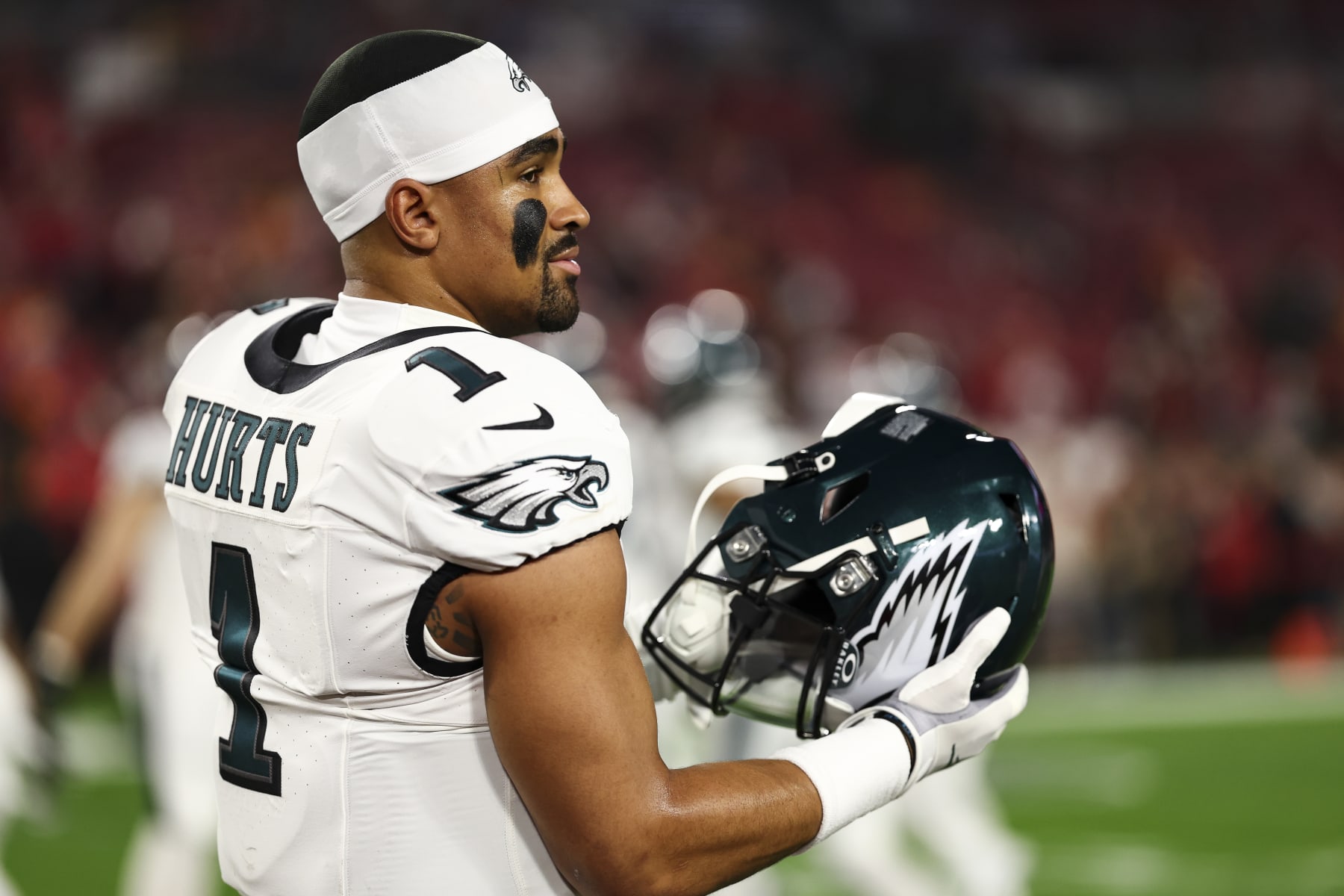 TAMPA, FL - JANUARY 15: Jalen Hurts #1 of the Philadelphia Eagles puts on his helmet prior to an NFL wild-card playoff football game against the Tampa Bay Buccaneers at Raymond James Stadium on January 15, 2024 in Tampa, Florida. (Photo by Kevin Sabitus/Getty Images)