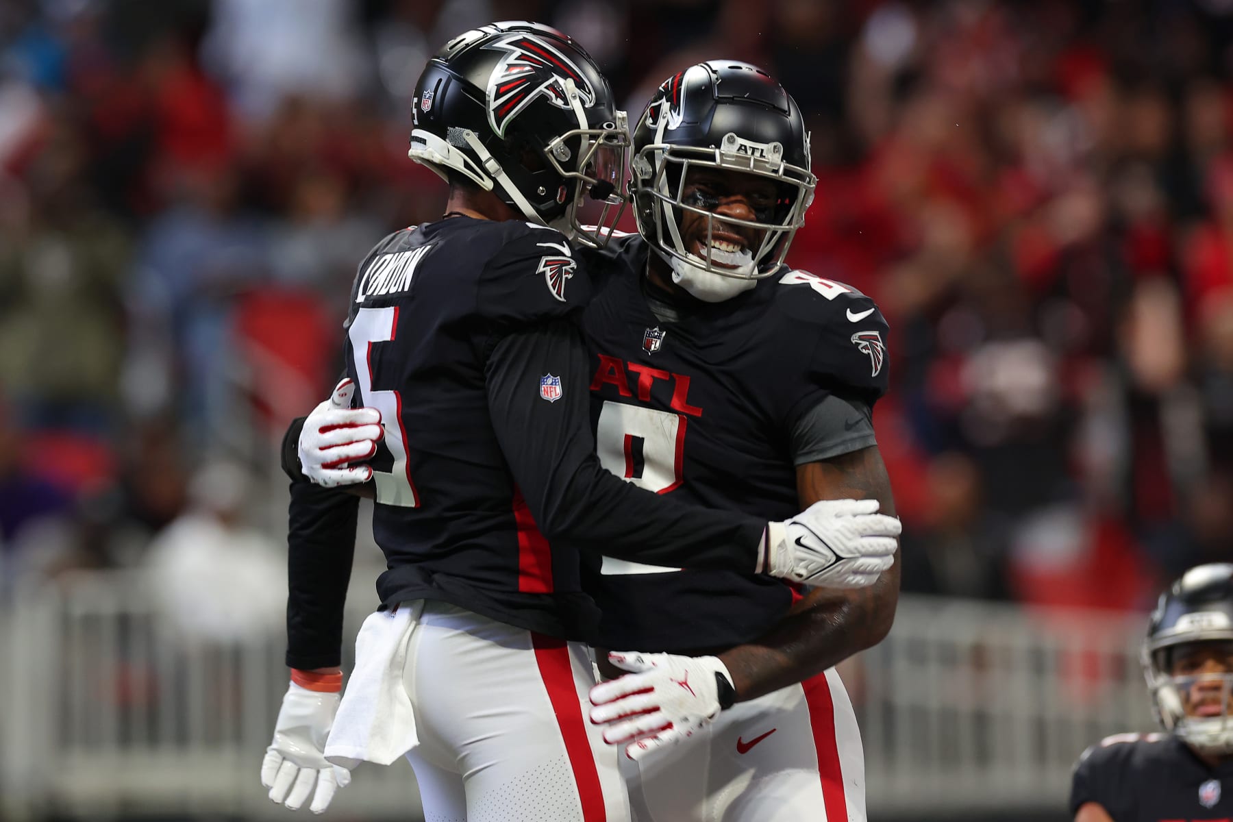 ATLANTA, GEORGIA - OCTOBER 30: Kyle Pitts #8 of the Atlanta Falcons celebrates a touchdown reception against the Carolina Panthers with teammate Drake London #5 of the Atlanta Falcons during the second quarter at Mercedes-Benz Stadium on October 30, 2022 in Atlanta, Georgia. (Photo by Kevin C. Cox/Getty Images)