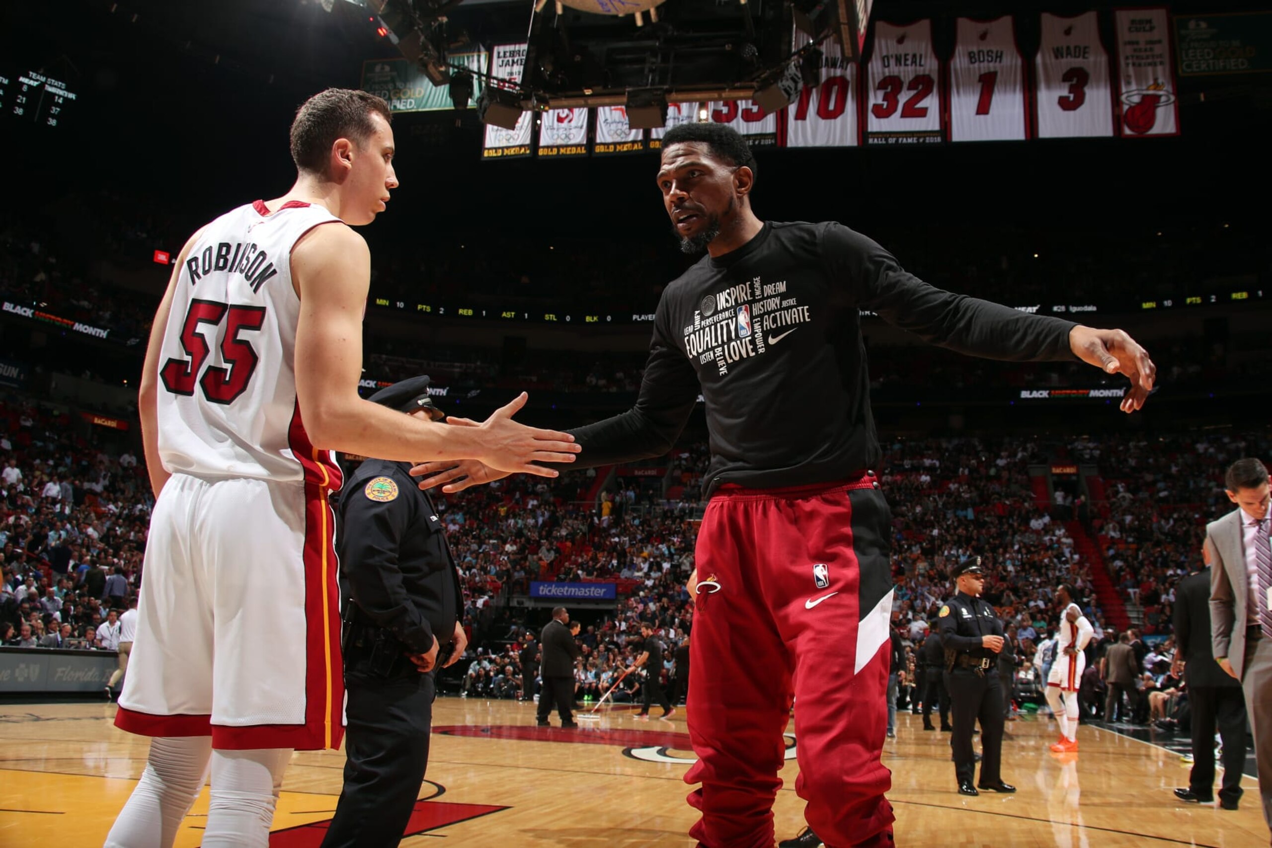 MIAMI, FL - FEBRUARY 26: Udonis Haslem #40 of the Miami Heat high fives Duncan Robinson #55 during the game against the Minnesota Timberwolves on February 26, 2020 at American Airlines Arena in Miami, Florida. NOTE TO USER: User expressly acknowledges and agrees that, by downloading and or using this Photograph, user is consenting to the terms and conditions of the Getty Images License Agreement. Mandatory Copyright Notice: Copyright 2020 NBAE (Photo by Issac Baldizon/NBAE via Getty Images)