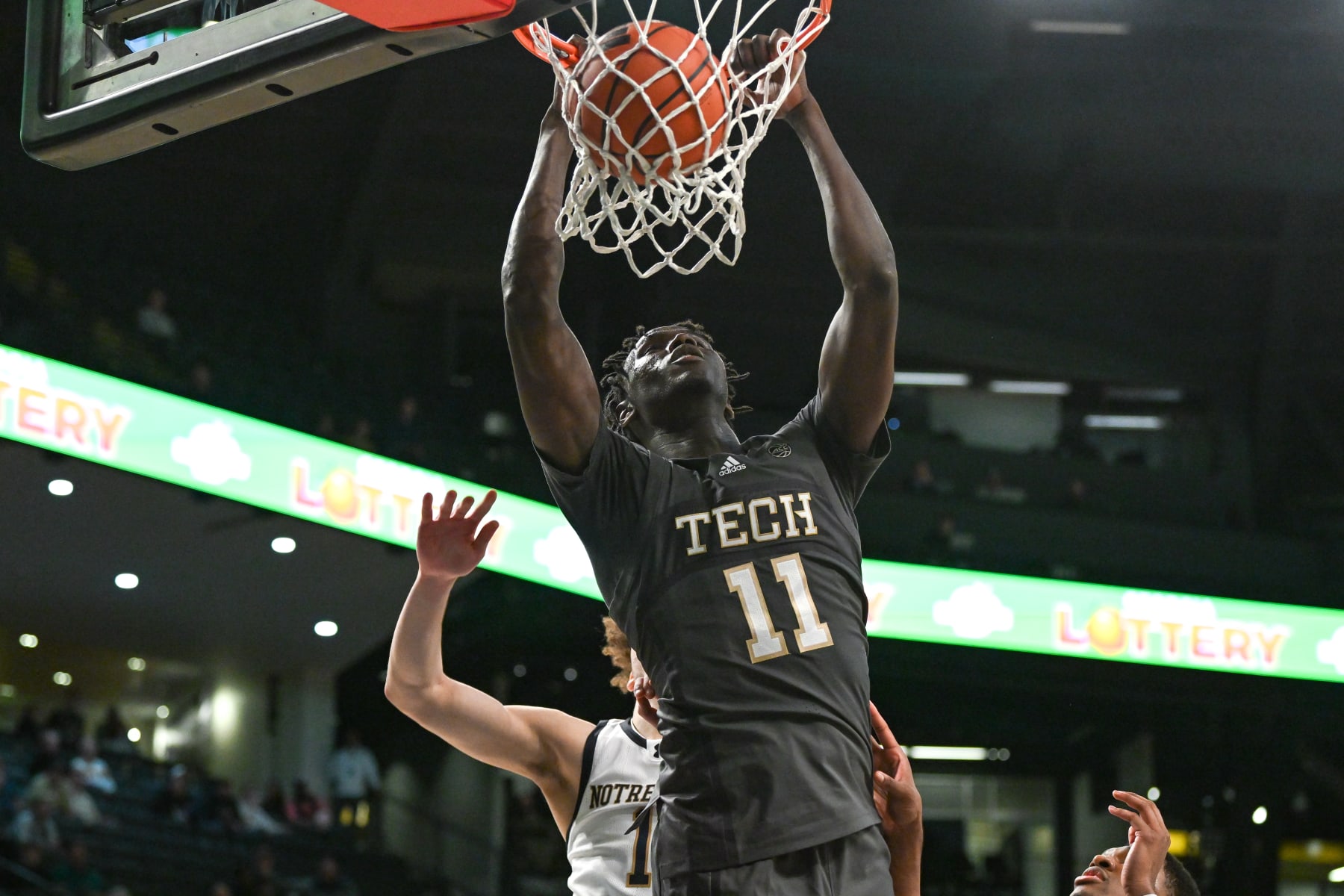 ATLANTA, GA  JANUARY 09:  Georgia Tech forward Baye Ndongo (11) dunks during the college basketball game between the Notre Dame Fighting Irish and the Georgia Tech Yellow Jackets on January 9th, 2024 at Hank McCamish Pavilion in Atlanta, GA.  (Photo by Rich von Biberstein/Icon Sportswire via Getty Images)
