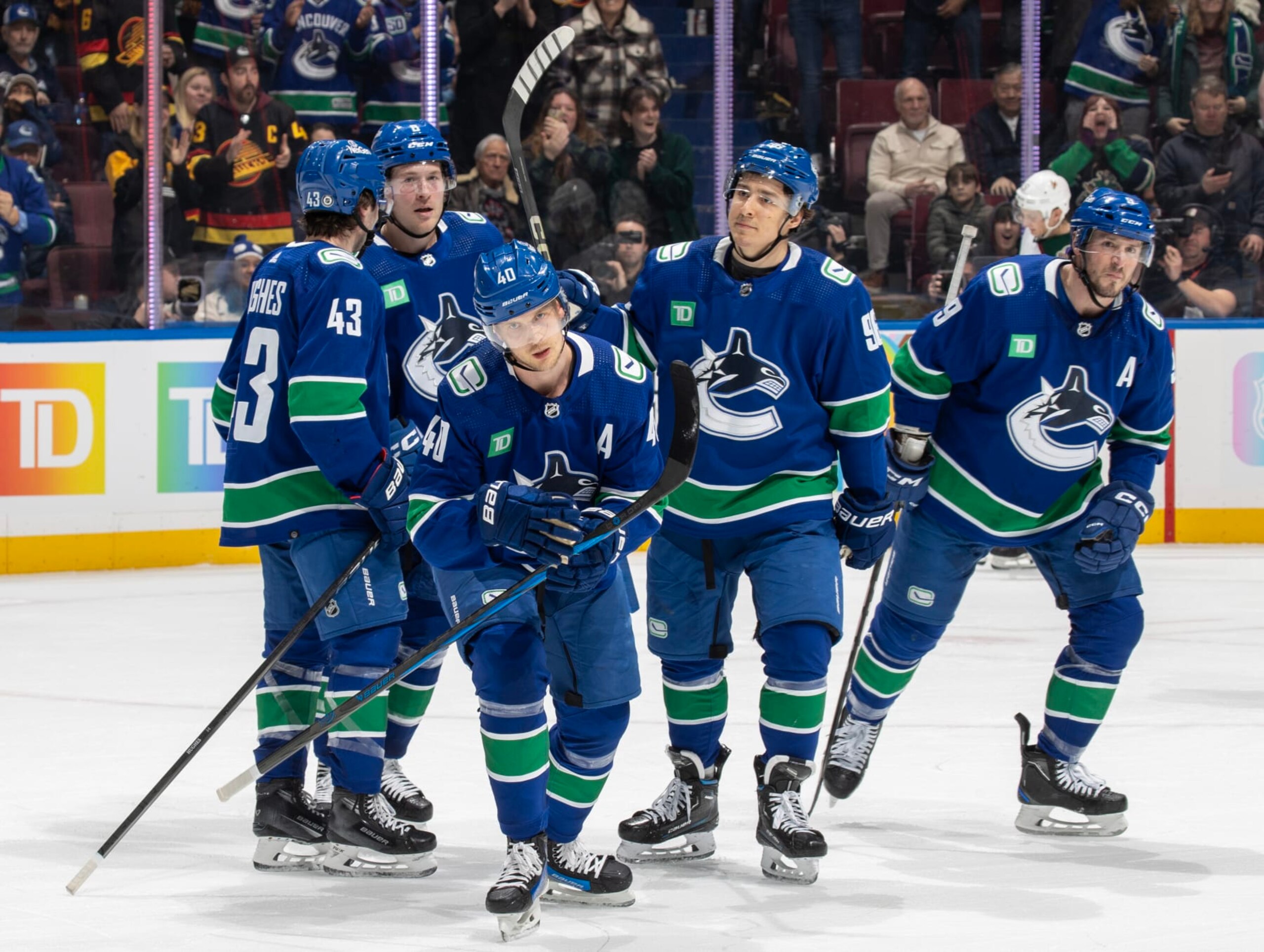 VANCOUVER, CANADA - JANUARY 18: Elias Pettersson #40 of the Vancouver Canucks skates back to the bench to celebrate his goal with teammates during the first period of their NHL game against the Arizona Coyotes at Rogers Arena on January 18, 2024 in Vancouver, British Columbia, Canada. (Photo by Jeff Vinnick/NHLI via Getty Images) VANCOUVER, CANADA - JANUARY 18: Elias Pettersson #40 of the Vancouver Canucks skates back to the bench to celebrate his goal with teammates during the first period of their NHL game against the Arizona Coyotes at Rogers Arena on January 18, 2024 in Vancouver, British Columbia, Canada. (Photo by Jeff Vinnick/NHLI via Getty Images)