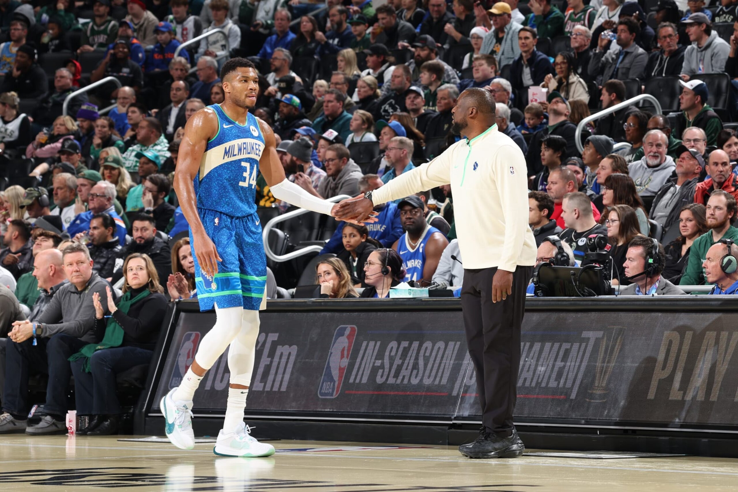 MILWAUKEE, WI - DECEMBER 5: Giannis Antetokounmpo #34 and Head Coach Adrian Griffin of the Milwaukee Bucks high five during the game against the New York Knicks during the In-Season Tournament Quarterfinals on December 5, 2023 at Fiserv Forum in Milwaukee, Wisconsin. NOTE TO USER: User expressly acknowledges and agrees that, by downloading and or using this photograph, User is consenting to the terms and conditions of the Getty Images License Agreement. Mandatory Copyright Notice: Copyright 2023 NBAE (Photo by Jeff Haynes/NBAE via Getty Images)