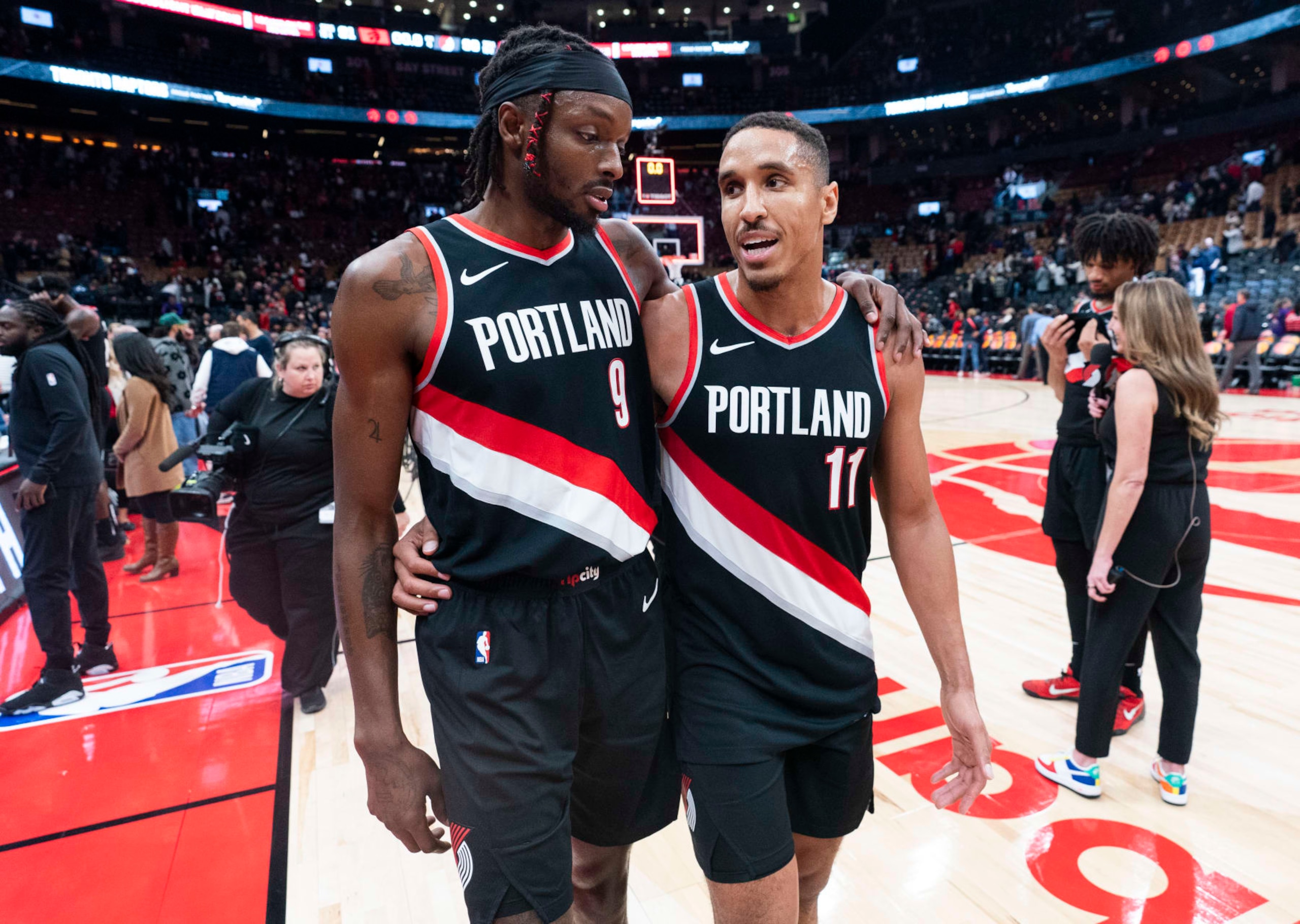 TORONTO, ON - OCTOBER 30: Malcolm Brogdon #11 and Jerami Grant #9 of the Portland Trail Blazers leave the floor after their team defeated the Toronto Raptors in their basketball game at the Scotiabank Arena on October 30, 2023 in Toronto, Ontario, Canada. NOTE TO USER: User expressly acknowledges and agrees that, by downloading and/or using this Photograph, user is consenting to the terms and conditions of the Getty Images License Agreement. (Photo by Mark Blinch/Getty Images)