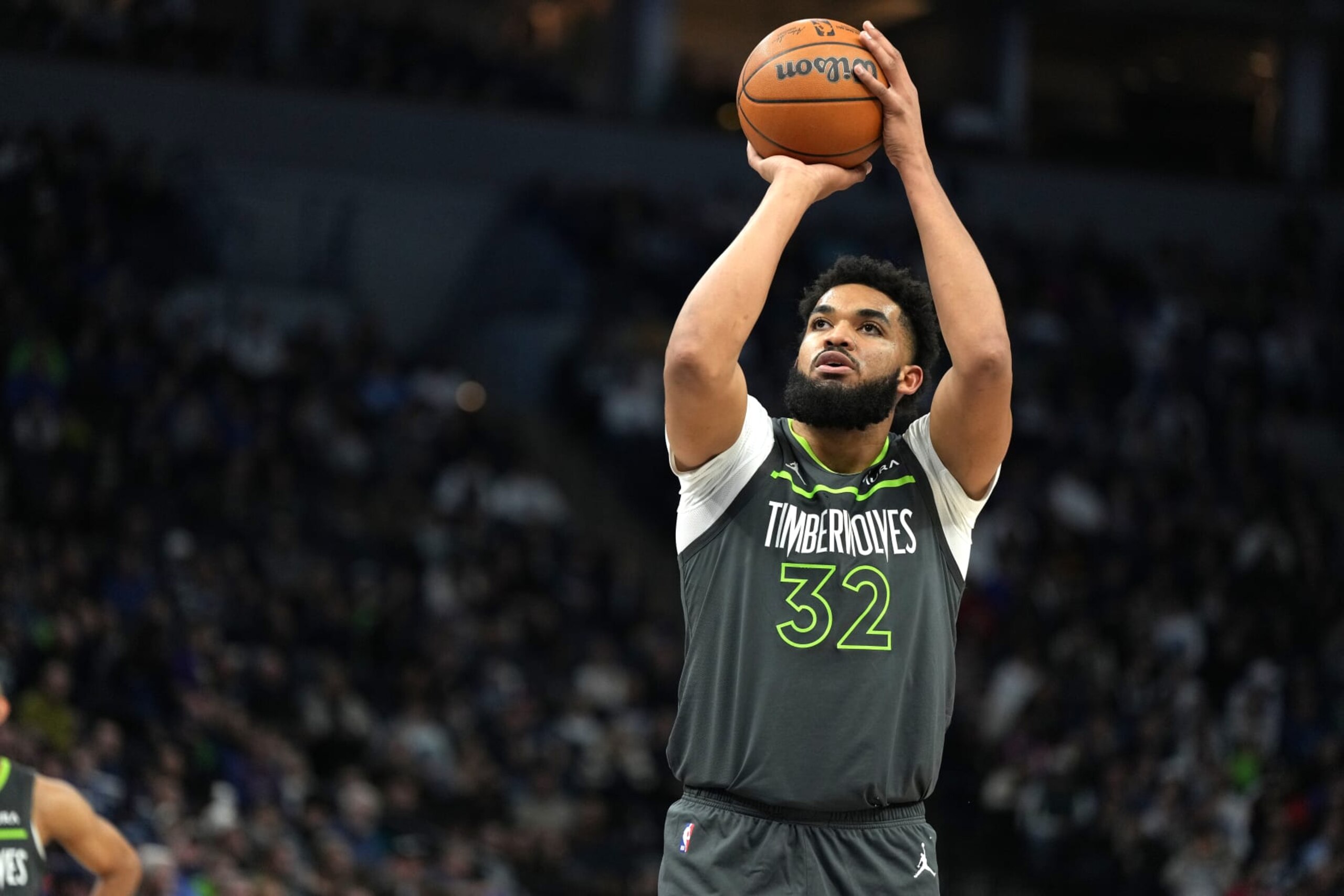 MINNEAPOLIS, MN -  JANUARY 22: Karl-Anthony Towns #32 of the Minnesota Timberwolves shoots a free throw during the game against the Charlotte Hornets on January 22, 2024 at Target Center in Minneapolis, Minnesota. NOTE TO USER: User expressly acknowledges and agrees that, by downloading and or using this Photograph, user is consenting to the terms and conditions of the Getty Images License Agreement. Mandatory Copyright Notice: Copyright 2024 NBAE (Photo by Jordan Johnson/NBAE via Getty Images)