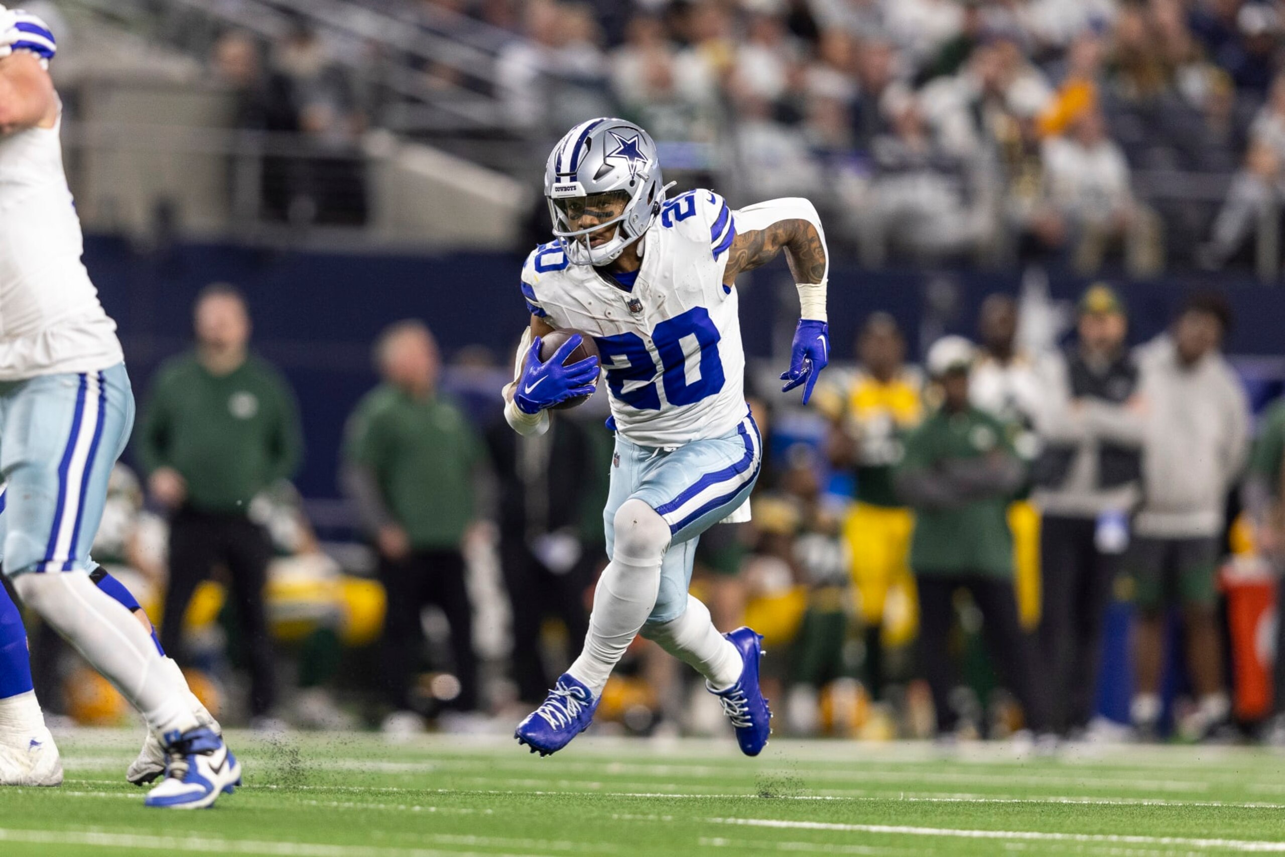ARLINGTON, TEXAS - JANUARY 14: Tony Pollard #20 of the Dallas Cowboys runs with the ball during an NFL wild-card playoff football game between the Dallas Cowboys and the Green Bay Packers at AT&T Stadium on January 14, 2024 in Arlington, Texas. (Photo by Michael Owens/Getty Images)
