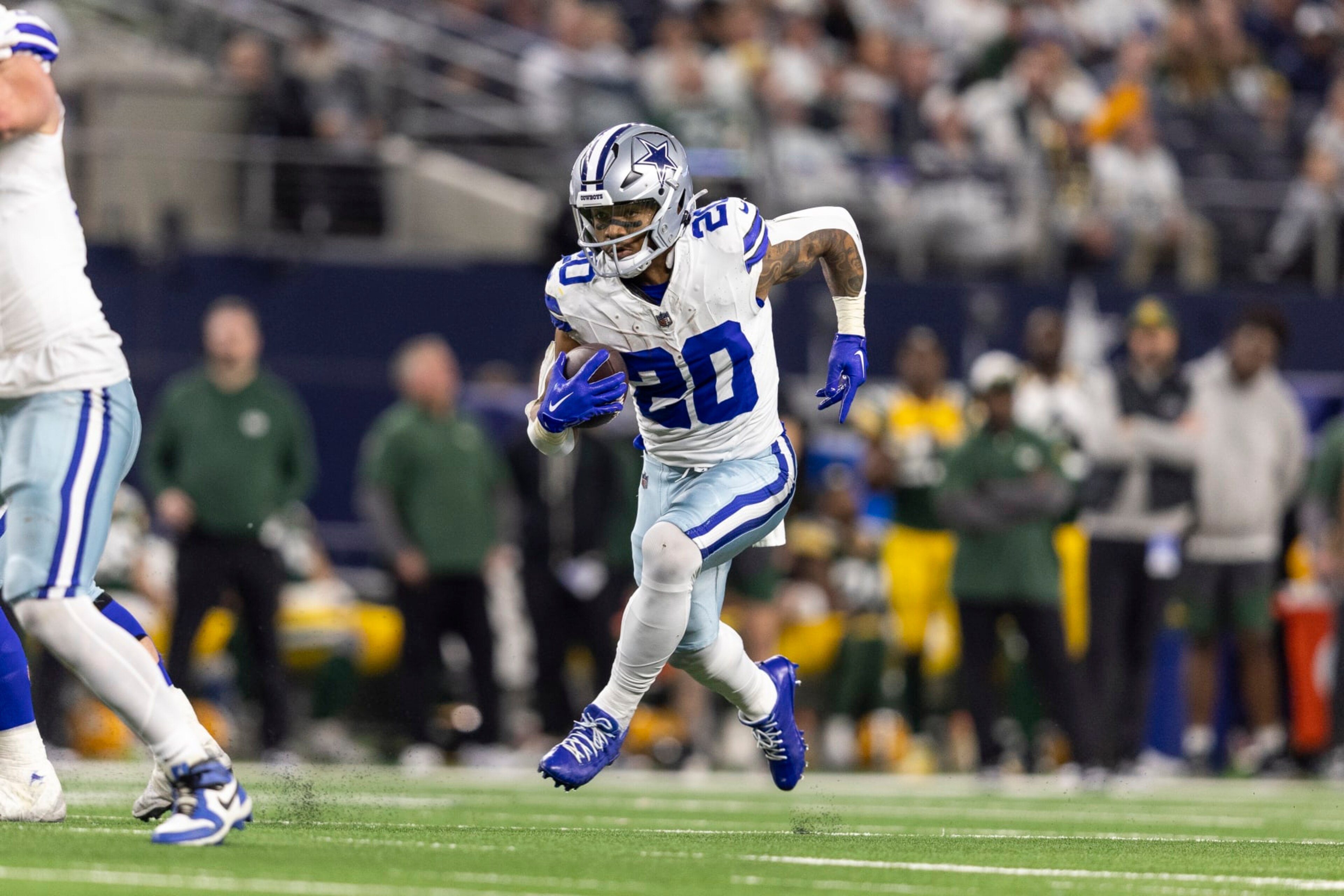 ARLINGTON, TEXAS - JANUARY 14: Tony Pollard #20 of the Dallas Cowboys runs with the ball during an NFL wild-card playoff football game between the Dallas Cowboys and the Green Bay Packers at AT&T Stadium on January 14, 2024 in Arlington, Texas. (Photo by Michael Owens/Getty Images)
