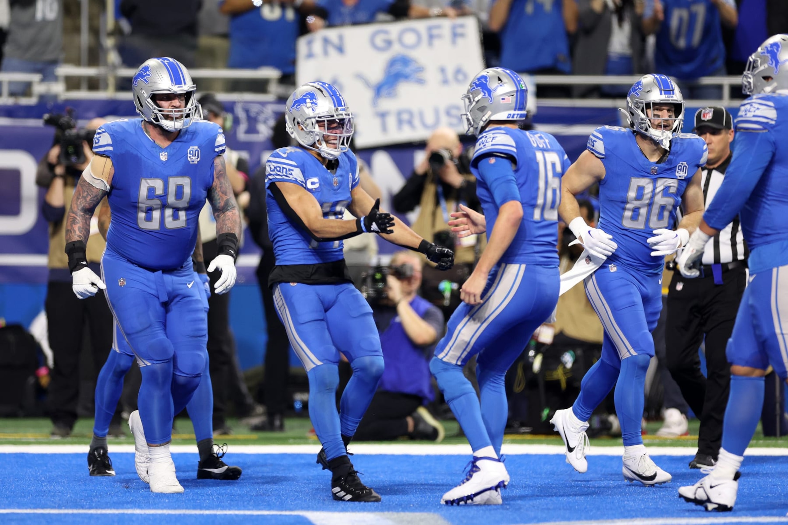 DETROIT, MICHIGAN - JANUARY 21: Amon-Ra St. Brown #14 of the Detroit Lions celebrates a touchdown with Jared Goff #16 while playing the Tampa Bay Buccaneers during a NFC Divisional Playoff game at Ford Field on January 21, 2024 in Detroit, Michigan. (Photo by Gregory Shamus/Getty Images)