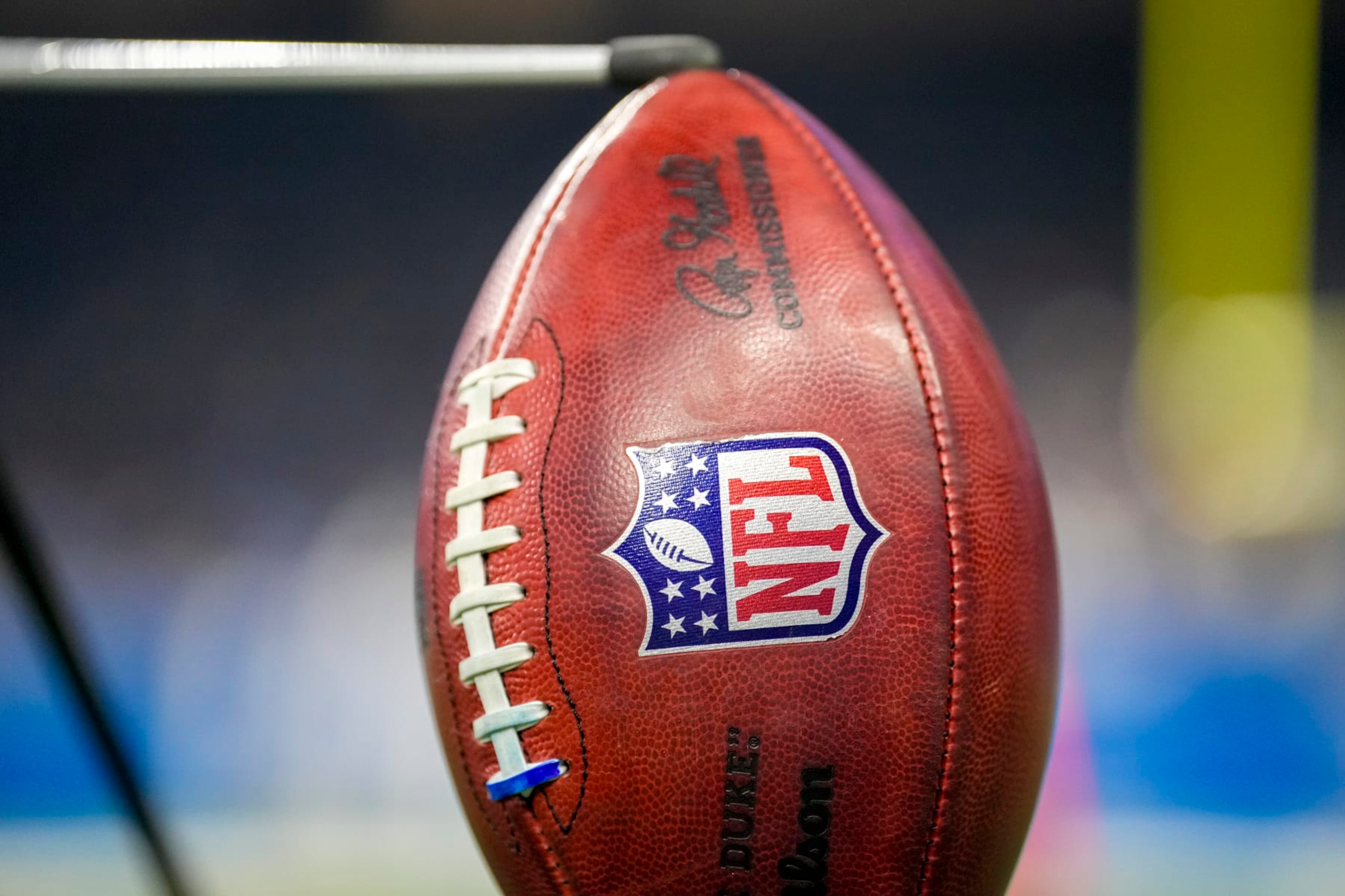 DETROIT, MICHIGAN - JANUARY 07: A detail of a Wilson brand NFL The Duke football held up by a kicking tee during the game between the Minnesota Vikings and Detroit Lions Ford Field on January 07, 2024 in Detroit, Michigan. (Photo by Nic Antaya/Getty Images)