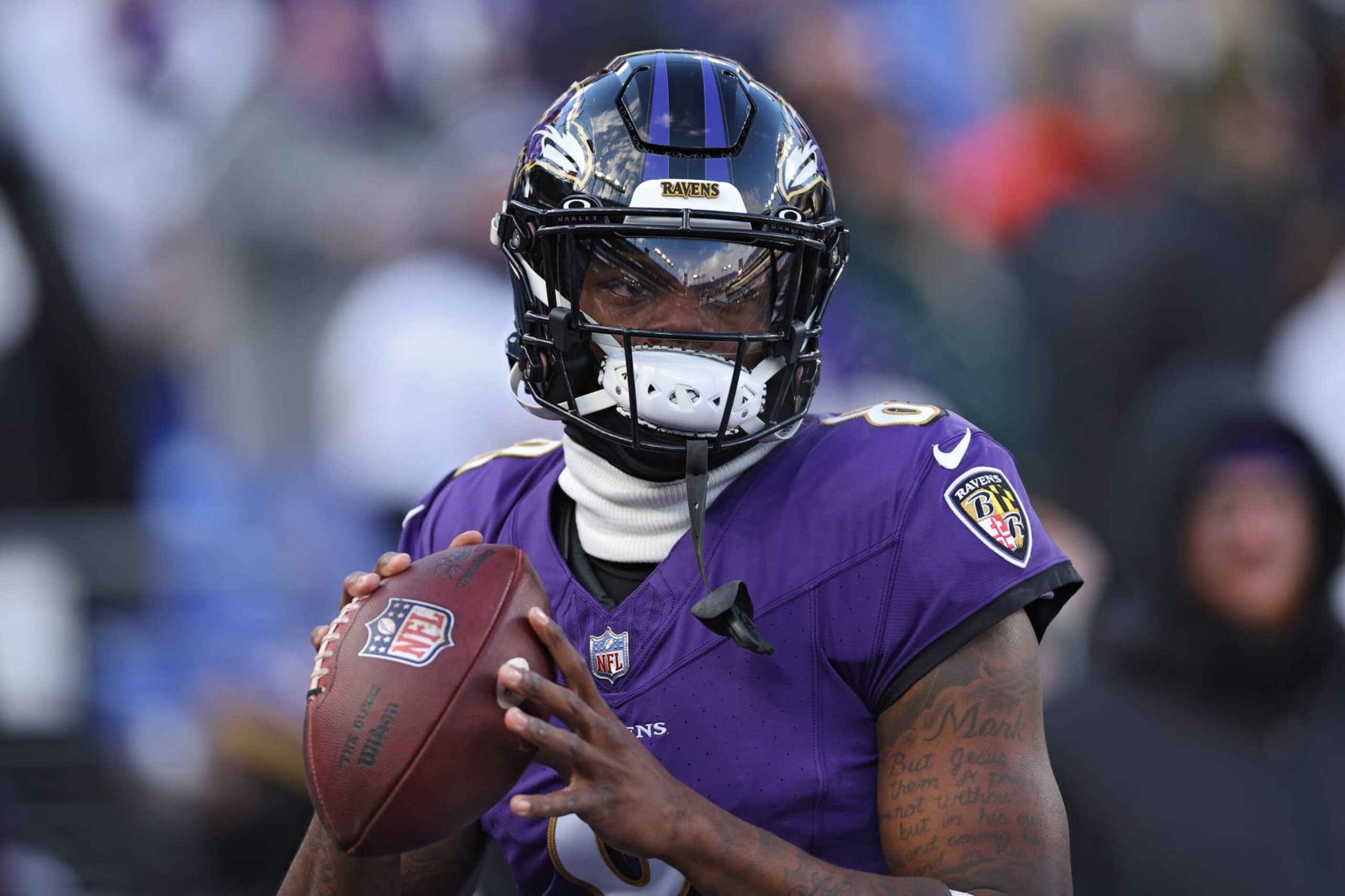 BALTIMORE, MARYLAND - JANUARY 20: Quarterback Lamar Jackson #8 of the Baltimore Ravens warms up before playing against the Houston Texans in the AFC Divisional Playoff game at M&T Bank Stadium on January 20, 2024 in Baltimore, Maryland. (Photo by Patrick Smith/Getty Images) BALTIMORE, MARYLAND - JANUARY 20: Quarterback Lamar Jackson #8 of the Baltimore Ravens warms up before playing against the Houston Texans in the AFC Divisional Playoff game at M&T Bank Stadium on January 20, 2024 in Baltimore, Maryland. (Photo by Patrick Smith/Getty Images)