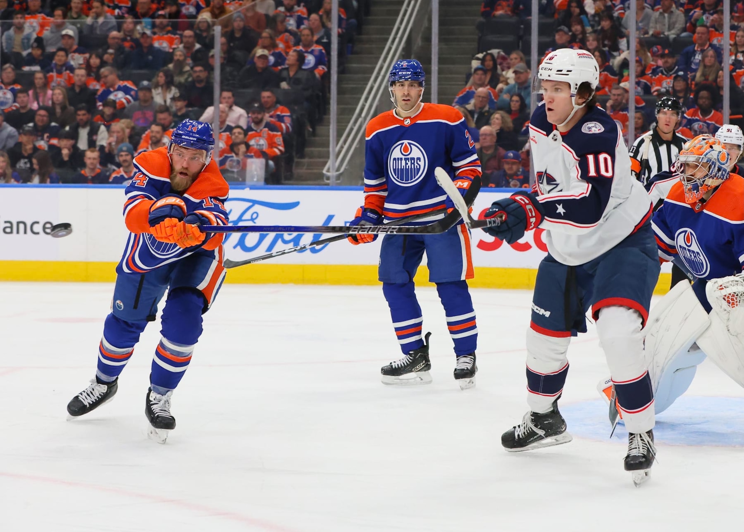 EDMONTON, CANADA - JANUARY 23: Dmitri Voronkov #10 of the Columbus Blue Jackets looks to deflect the puck on the power play in the second period against the Edmonton Oilers on January 23, 2024 at Rogers Place in Edmonton, Alberta, Canada. (Photo by Lawrence Scott/Getty Images)