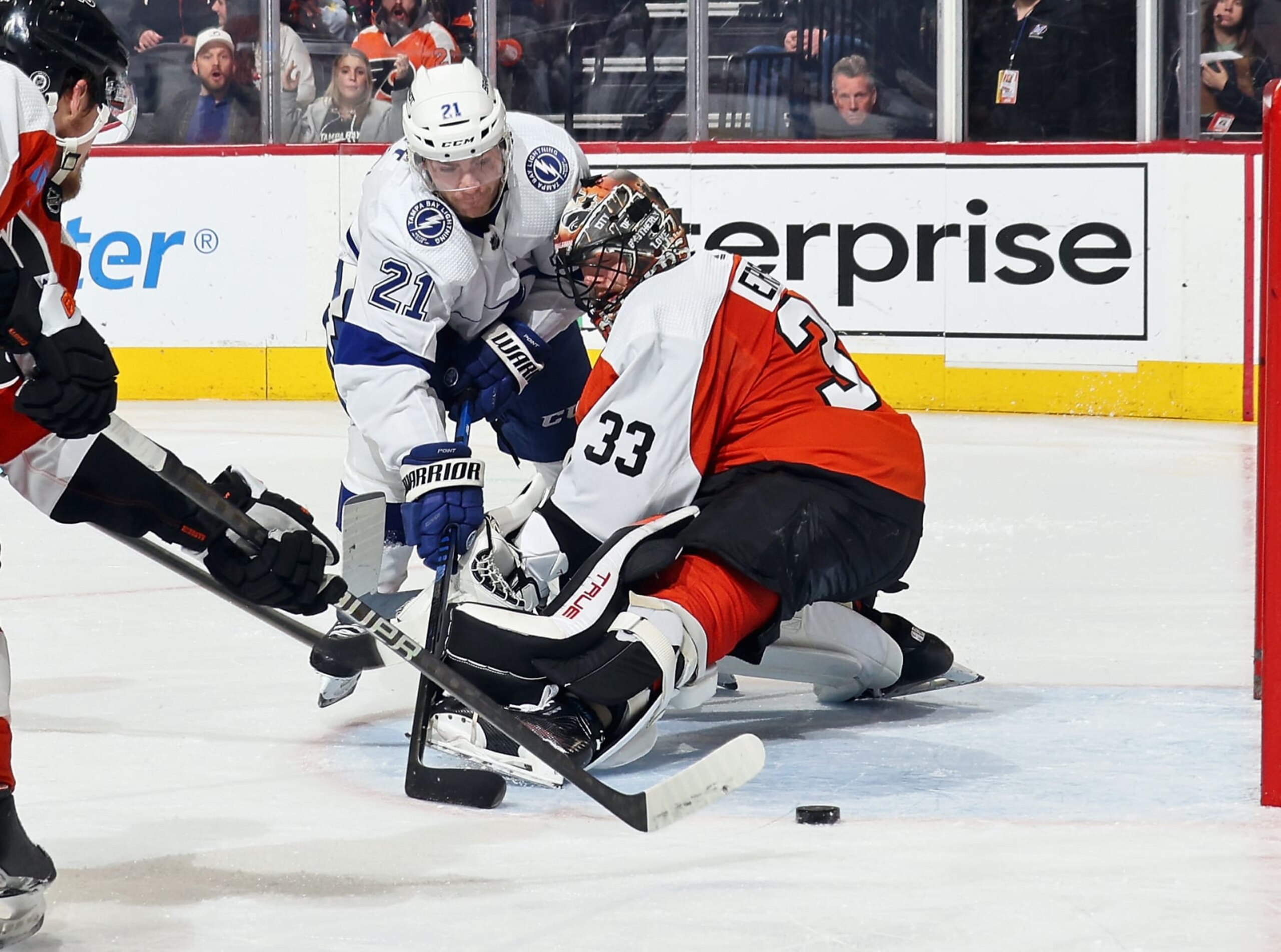 PHILADELPHIA, PENNSYLVANIA - JANUARY 23: Brayden Point #21 of the Tampa Bay Lightning attempts a scoring chance against goaltender Samuel Ersson #33 of the Philadelphia Flyers at the Wells Fargo Center on January 23, 2024 in Philadelphia, Pennsylvania.  (Photo by Len Redkoles/NHLI via Getty Images)