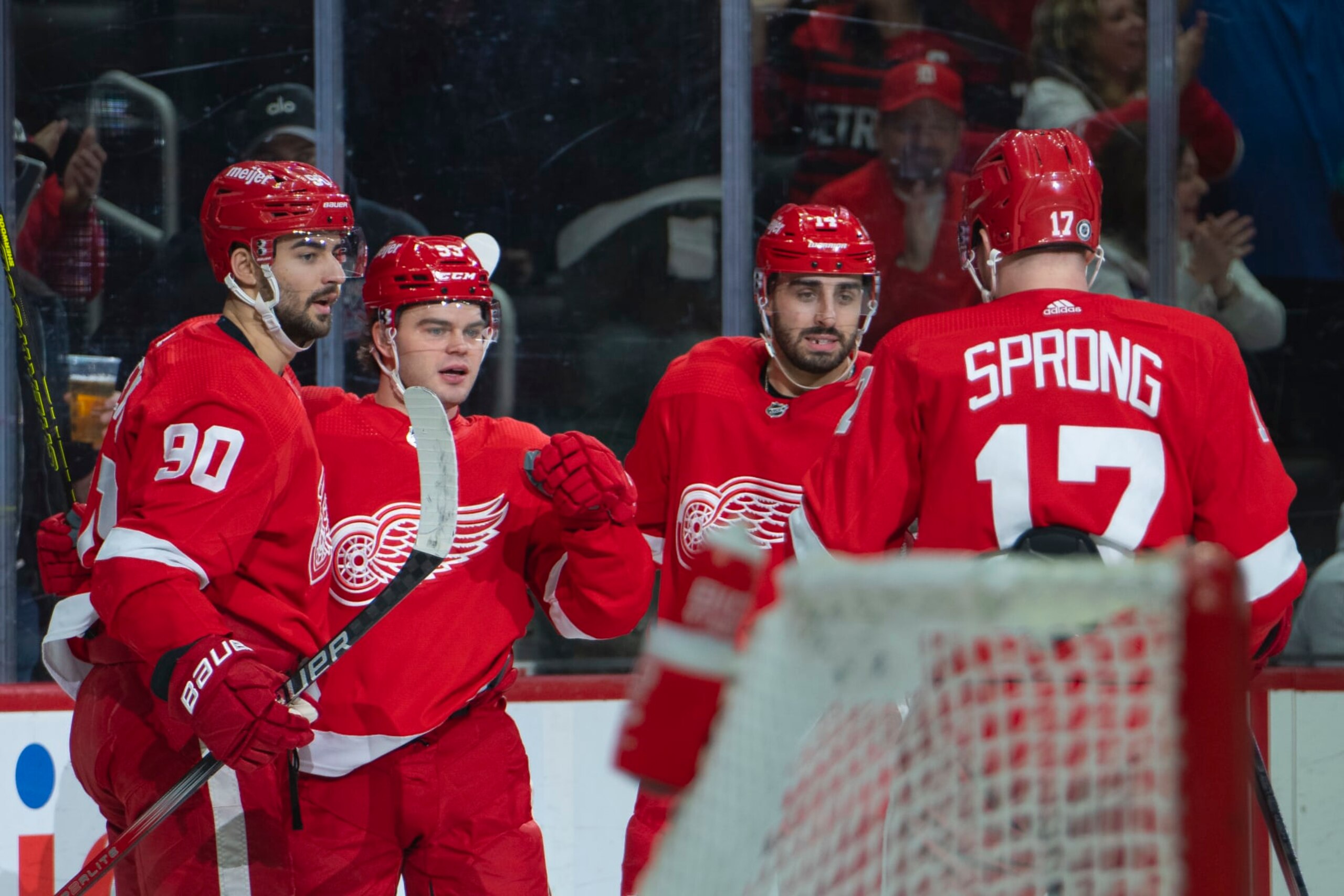 DETROIT, MI - JANUARY 23: Alex DeBrincat #93 of the Detroit Red Wings celebrates his goal with teammates during the first period against the Dallas Stars at Little Caesars Arena on January 23, 2024 in Detroit, Michigan. (Photo by Darren Clark/NHLI via Getty Images)