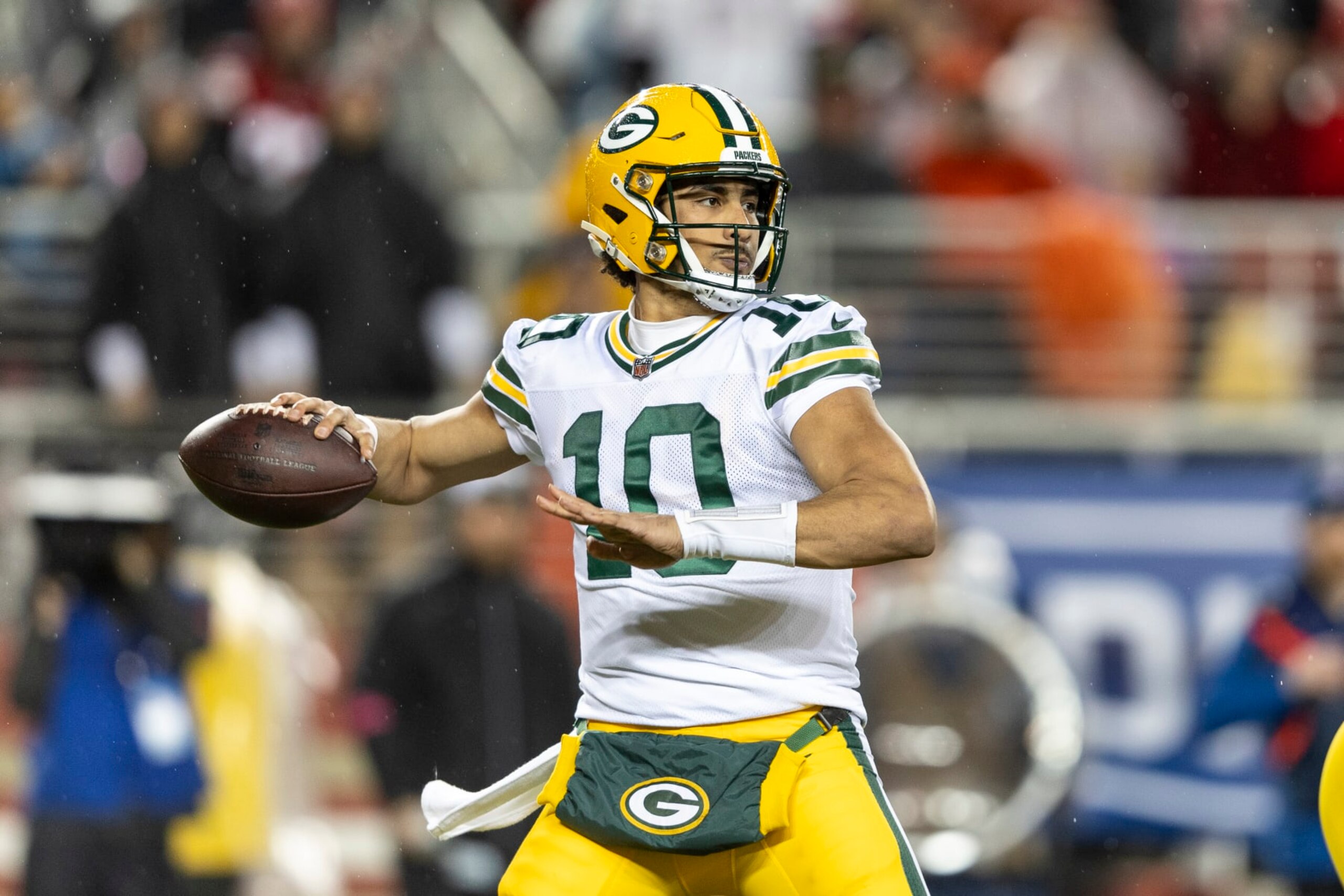 SANTA CLARA, CALIFORNIA - JANUARY 20: Jordan Love #10 of the Green Bay Packers looks to pass during an NFL divisional round playoff football game between the San Francisco 49ers and the Green Bay Packers at Levi's Stadium on January 20, 2024 in Santa Clara, California. (Photo by Michael Owens/Getty Images)