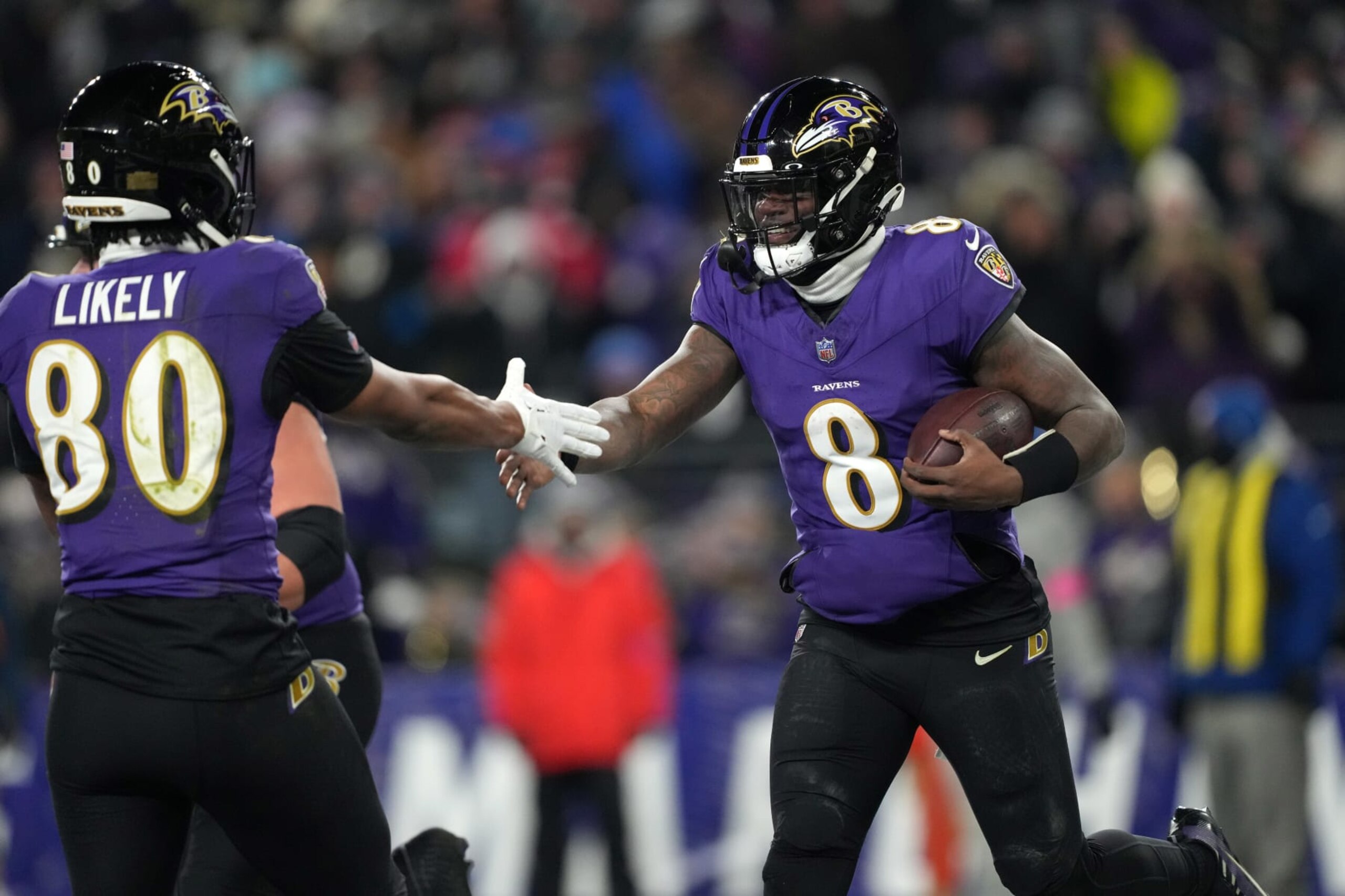 BALTIMORE, MARYLAND, JANUARY 20: Quarterback Lamar Jackson #8 of the Baltimore Ravens celebrates with tight end Isaiah Likely #80 after a touchdown against the Houston Texans in the AFC Divisional Playoff game at M&T Bank Stadium on January 20, 2024 in Baltimore, Maryland. The Ravens defeated the Texans 34-10. (Photo by Kirby Lee/Getty Images) BALTIMORE, MARYLAND, JANUARY 20: Quarterback Lamar Jackson #8 of the Baltimore Ravens celebrates with tight end Isaiah Likely #80 after a touchdown against the Houston Texans in the AFC Divisional Playoff game at M&T Bank Stadium on January 20, 2024 in Baltimore, Maryland. The Ravens defeated the Texans 34-10. (Photo by Kirby Lee/Getty Images)