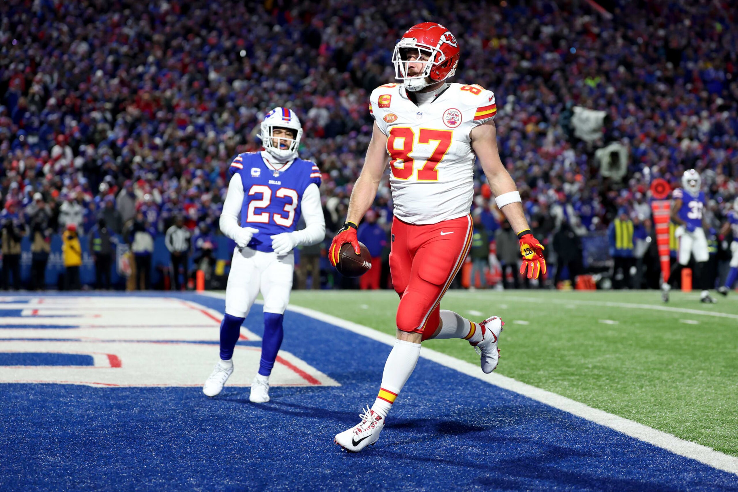 ORCHARD PARK, NEW YORK - JANUARY 21: Travis Kelce #87 of the Kansas City Chiefs celebrates after scoring a 22 yard touchdown against the Buffalo Bills during the second quarter in the AFC Divisional Playoff game at Highmark Stadium on January 21, 2024 in Orchard Park, New York. (Photo by Al Bello/Getty Images) ORCHARD PARK, NEW YORK - JANUARY 21: Travis Kelce #87 of the Kansas City Chiefs celebrates after scoring a 22 yard touchdown against the Buffalo Bills during the second quarter in the AFC Divisional Playoff game at Highmark Stadium on January 21, 2024 in Orchard Park, New York. (Photo by Al Bello/Getty Images)