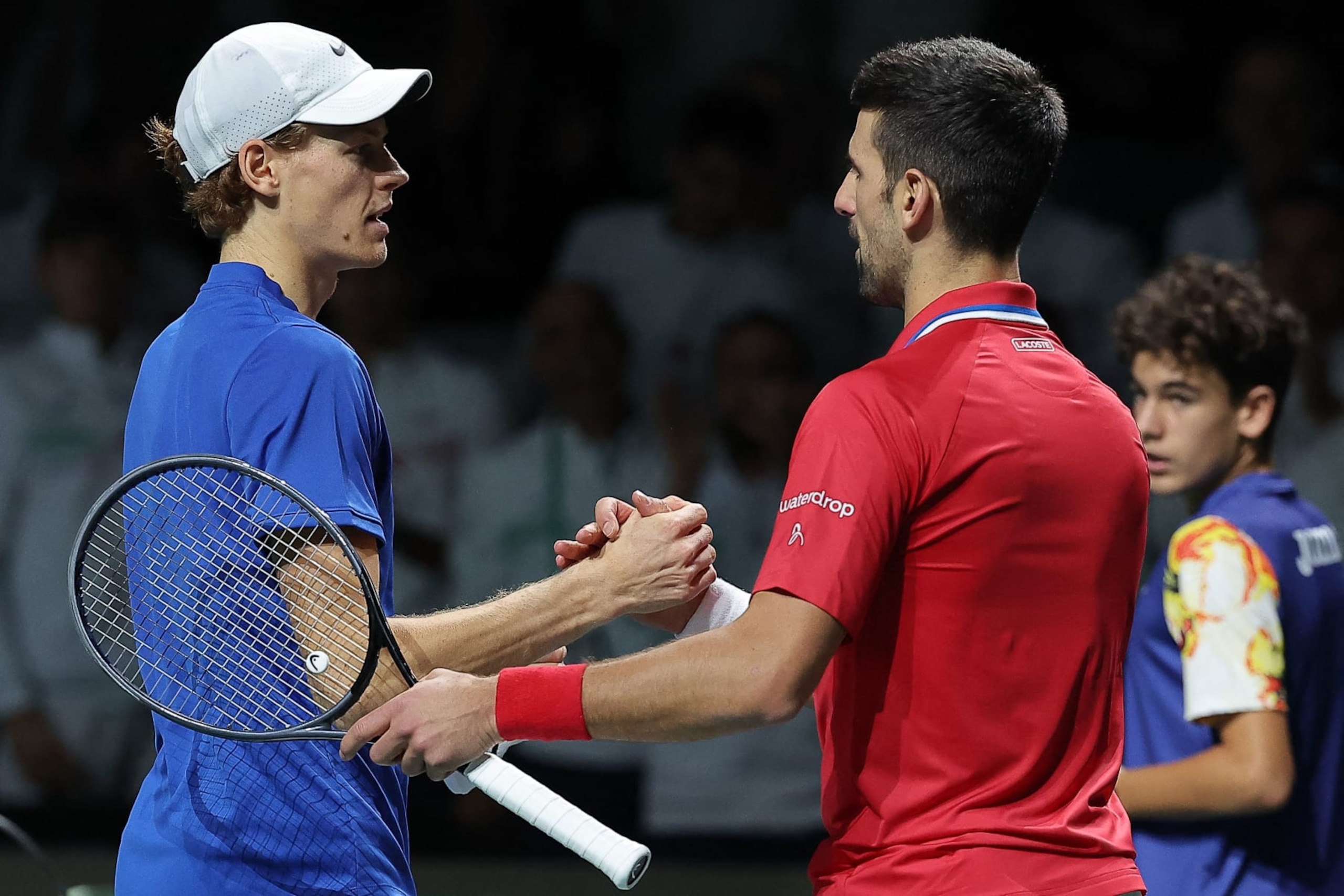 Italy's Jannik Sinner greets Serbia's Novak Djokovic after winning the second men's singles semifinal tennis match between Italy and Serbia of the Davis Cup tennis tournament at the Martin Carpena sportshall, in Malaga on November 25, 2023. (Photo by LLUIS GENE / AFP) (Photo by LLUIS GENE/AFP via Getty Images) Italy's Jannik Sinner greets Serbia's Novak Djokovic after winning the second men's singles semifinal tennis match between Italy and Serbia of the Davis Cup tennis tournament at the Martin Carpena sportshall, in Malaga on November 25, 2023. (Photo by LLUIS GENE / AFP) (Photo by LLUIS GENE/AFP via Getty Images)